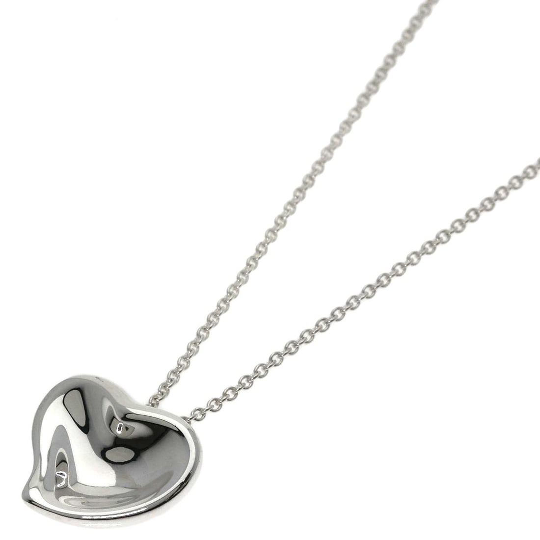 Full Heart Necklace Silver by Tiffany&Co: Full Heart Necklace Silver by Tiffany&Co Silver Full Heart Necklace by Tiffany&Co features a sleek and modern design with a 15.7-inch length, making it a versatile accessory for everyday wear. This st