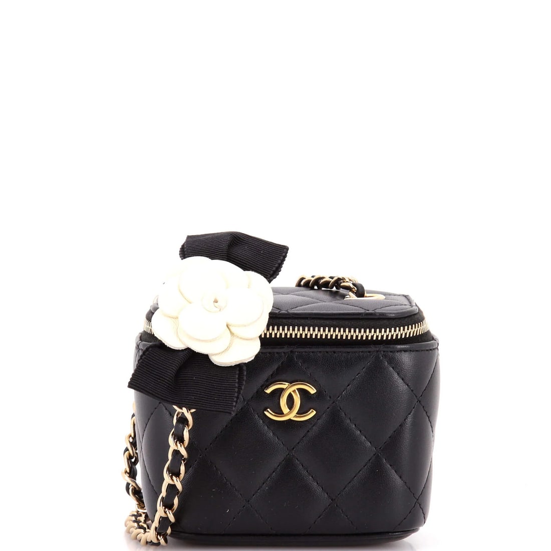 Camellia Bow Vanity Case with Chain Quilted Lambskin Mini Chanel: Camellia Bow Vanity Case with Chain Quilted Lambskin Mini Chanel The Camellia Bow Vanity Case with Chain Quilted Lambskin Mini Chanel boasts a sleek black leather exterior adorned with a delicate