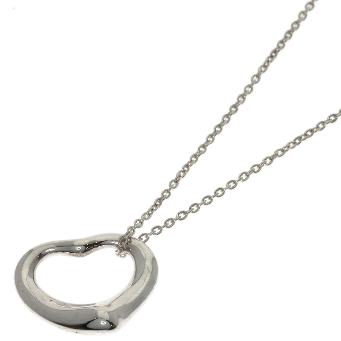 Open Heart Necklace by Tiffany & Co: Open Heart Necklace by Tiffany & Co Silver Open Heart Necklace by Tiffany & Co, featuring a sleek 16.3inch design with a silver exterior. This elegant necklace showcases the iconic Tiffany & Co. style