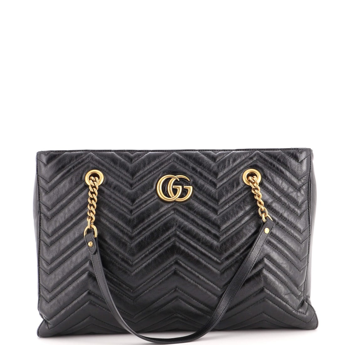 Gucci GG Marmont Zip Tote Matelasse Leather Medium: Gucci GG Marmont Zip Tote Matelasse Leather Medium Black GG Marmont Zip Tote features matelasse leather exterior with minor creases and edge wear, and a neutral microfiber interior. The medium size