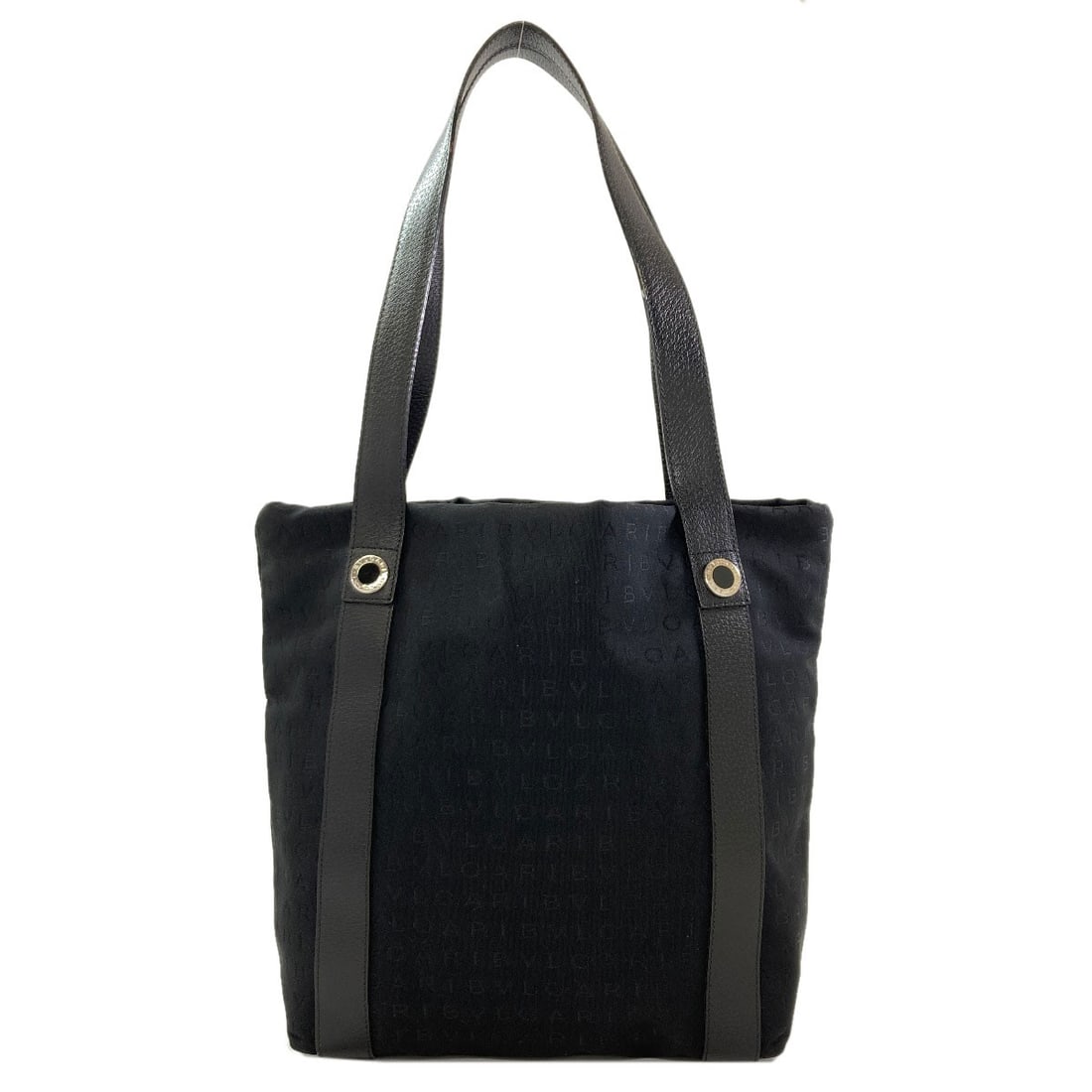 Logo Mania Bag Canvas by Bvlgari: Logo Mania Bag Canvas by Bvlgari Black canvas tote bag with open closure, measuring 12.6 inches in height and 11.0-15.0 inches in width, made by BVLGARI. The bag features a signature and bears a