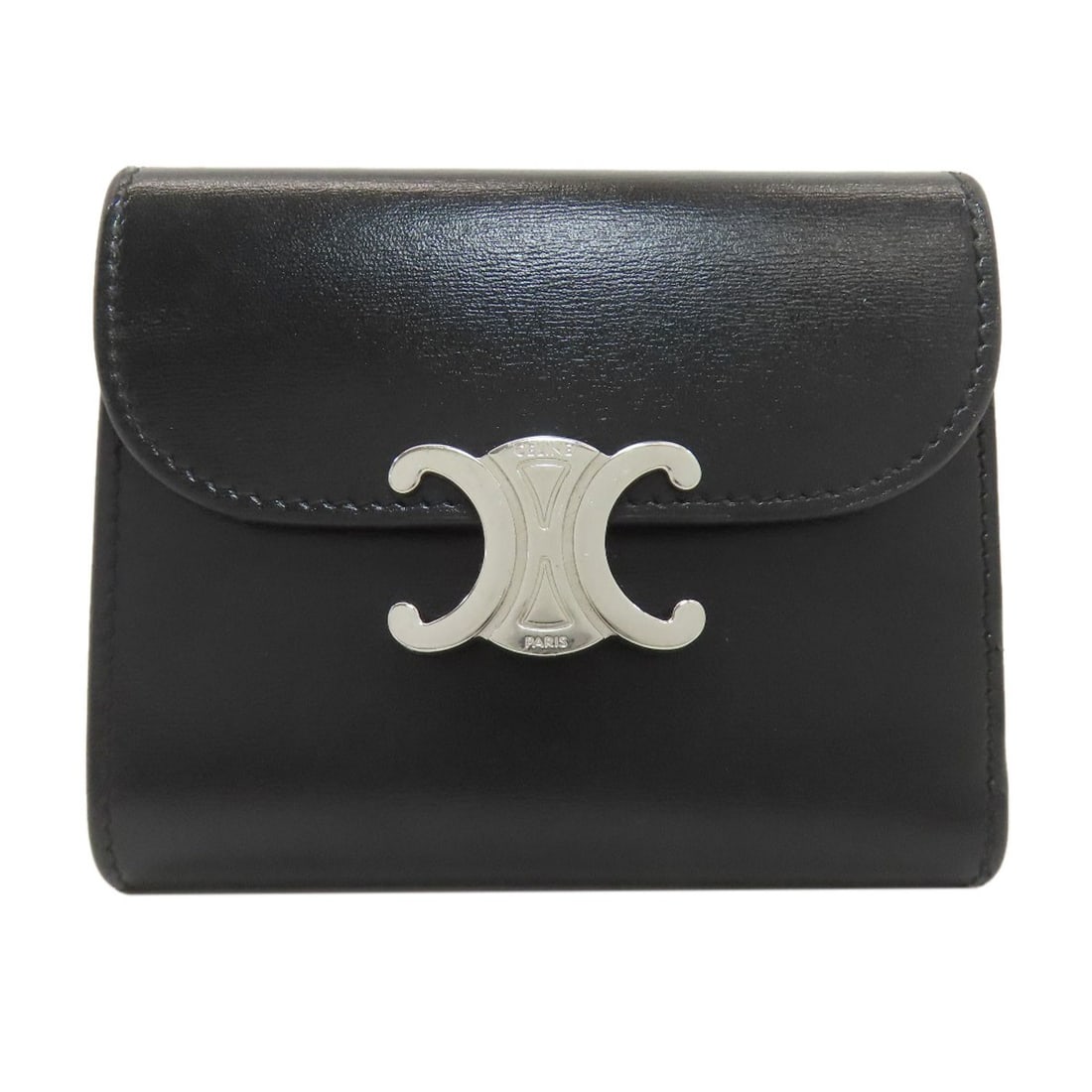 Celine Triomphe Flap Tri-Fold Wallet (With Coin Pocket) Leather: Celine Triomphe Flap Tri-Fold Wallet (With Coin Pocket) Leather Black Celine Triomphe Flap Tri-Fold Wallet with Coin Pocket features a sleek tri-fold design and a spacious coin pocket, making it a