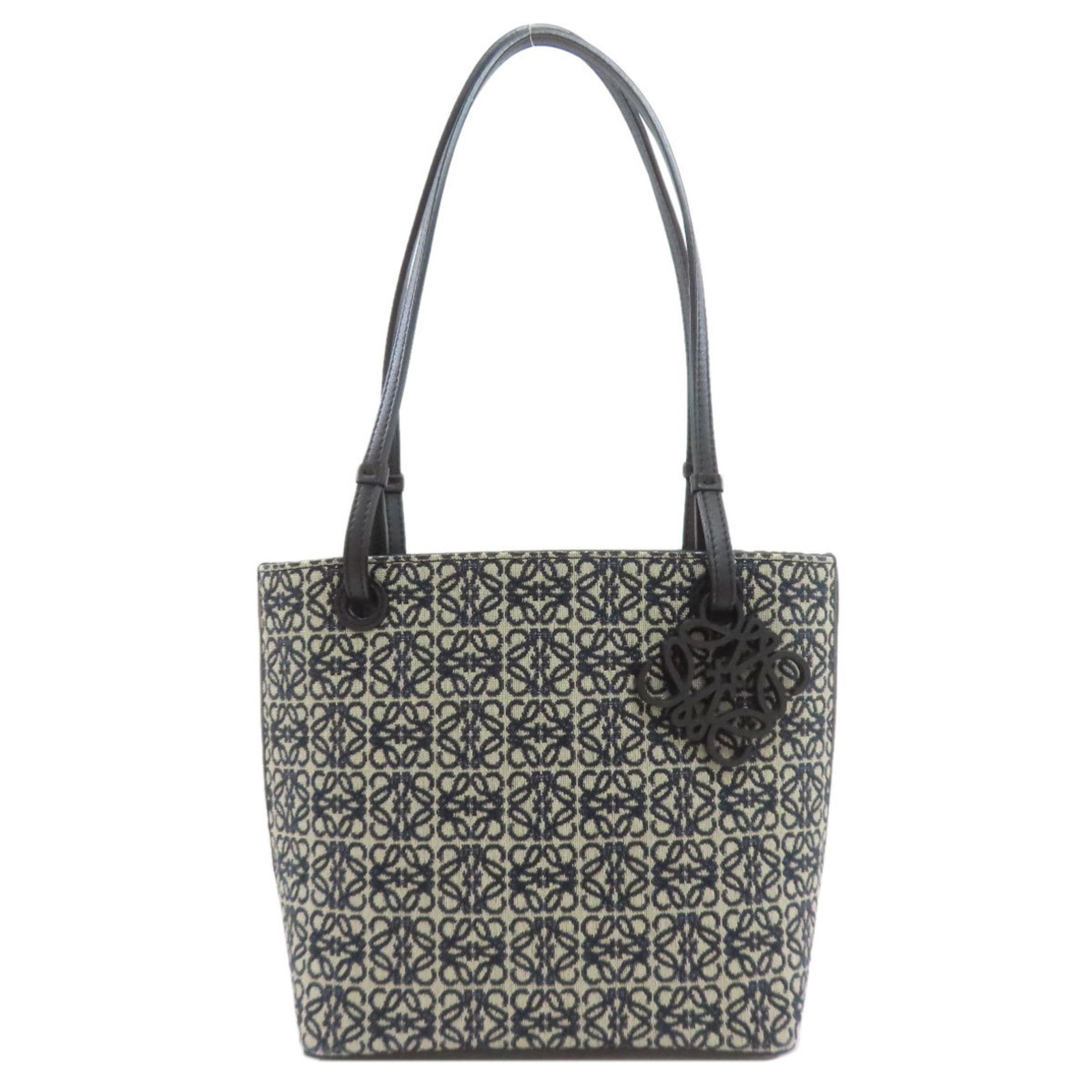 Loewe Tote Bag Canvas Leather: Loewe Tote Bag Canvas Leather Canvas and leather combine in this stylish Loewe tote bag, available in three neutral colors: beige, black, and navy. The bag's dimensions and handle length provide a