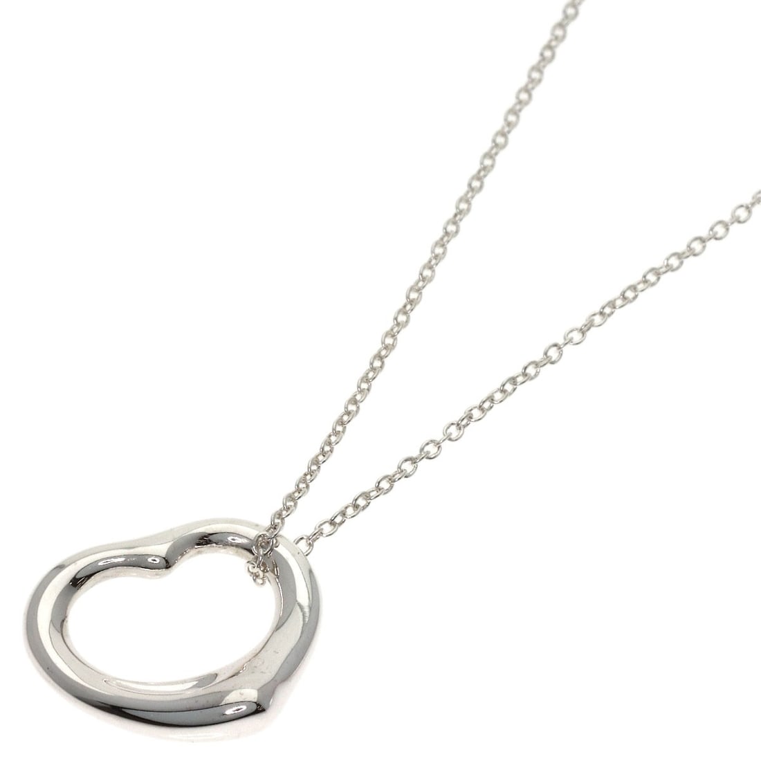 Open Heart Necklace by Tiffany & Co: Open Heart Necklace by Tiffany & Co Open Heart Necklace by Tiffany & Co is a sleek and modern silver necklace featuring a striking design. Made from high-quality silver metal, this necklace boasts a