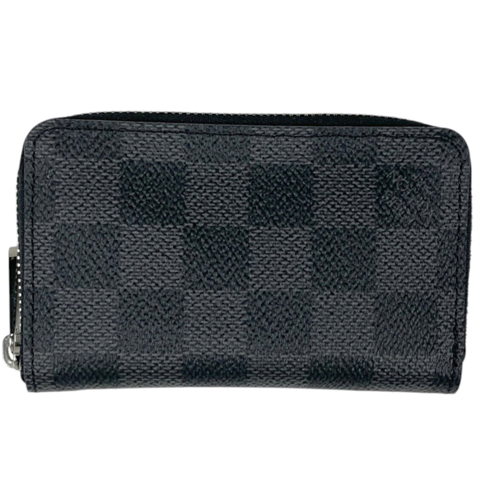 Louis Vuitton Coin Purse/ Coin Case Damier Graphite: Louis Vuitton Coin Purse/ Coin Case Damier Graphite The Louis Vuitton Coin Purse/ Coin Case Damier Graphite is a sleek and sophisticated accessory, featuring the iconic Damier Graphite pattern in a