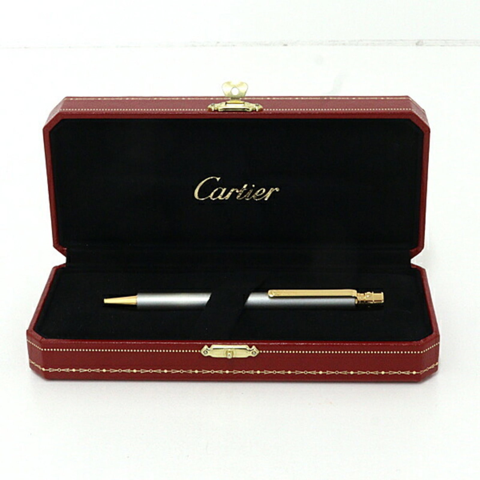 Pen Ballpoint Cartier: Pen Ballpoint Cartier The Cartier Santos de Cartier ballpoint pen is a sleek and sophisticated writing instrument, measuring 12.5cm in length and weighing 28g. Its black and multi-color design adds a