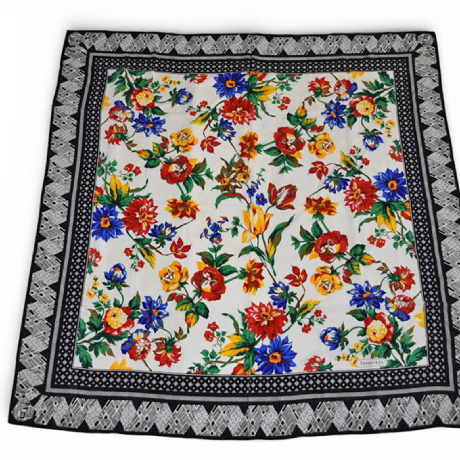 Silk Scarf Tiffany: Silk Scarf Tiffany Silk Scarf from Tiffany Country of Origin: Italy, made from high-quality silk with a striking black and multi-color design. Measuring 1.38m x 1.36m, this luxurious scarf is a