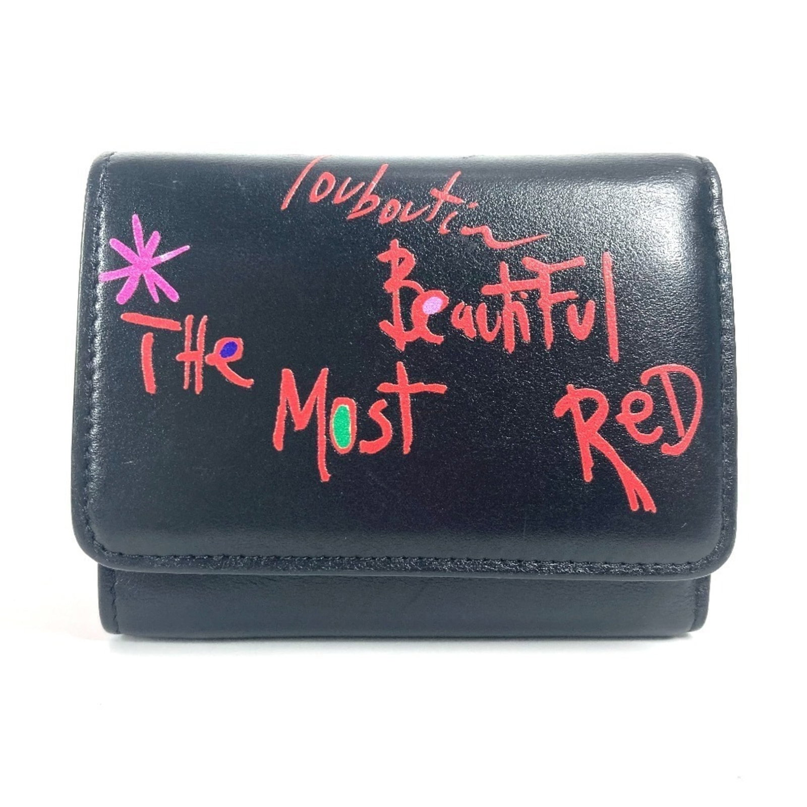 Christian Louboutin Wallet (Tri-Fold) Leather: Christian Louboutin Wallet (Tri-Fold) Leather Christian Louboutin's tri-fold leather wallet is a stylish accessory, featuring a sleek black design with a touch of multi-color accents. The compact