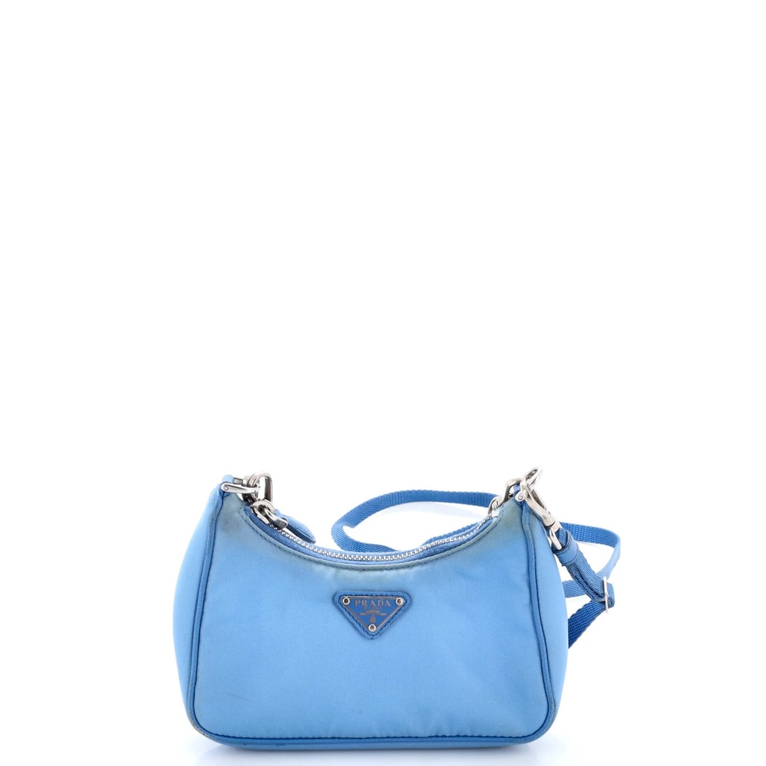 Tessuto Mini Shoulder Bag Prada Re: Tessuto Mini Shoulder Bag Prada Re The Prada Tessuto Mini Shoulder Bag Prada Re features a striking blue nylon exterior with a signature Tessuto fabric interior. Measuring 3.5" high and 6" wide, this 