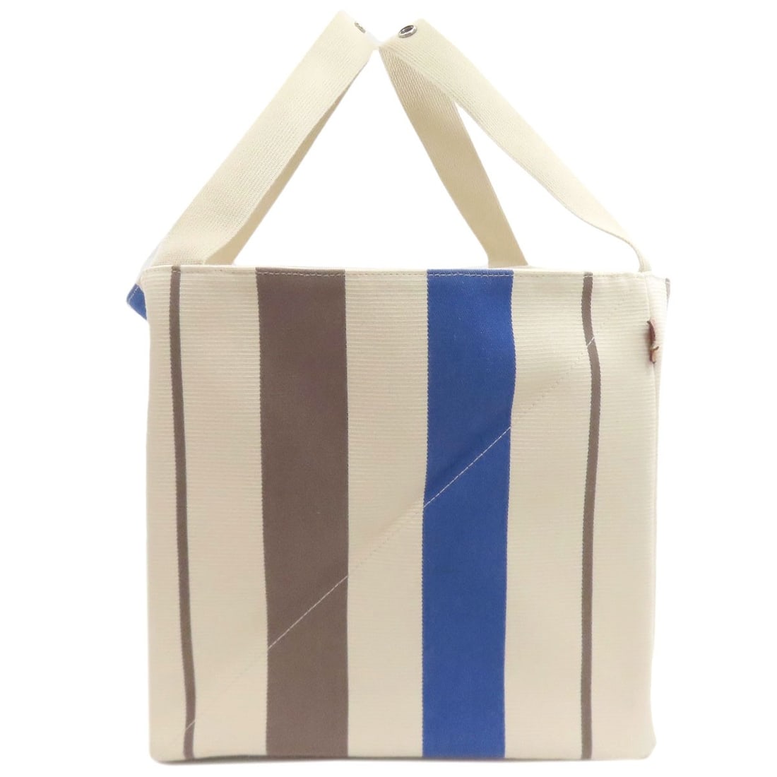 Hermes Canvas Zulu Pm Tote Bag: Hermes Canvas Zulu Pm Tote Bag White canvas tote bag from HERMES, featuring a classic style with a simple, elegant design. The bag's exterior is made from high-quality canvas, providing a durable and 