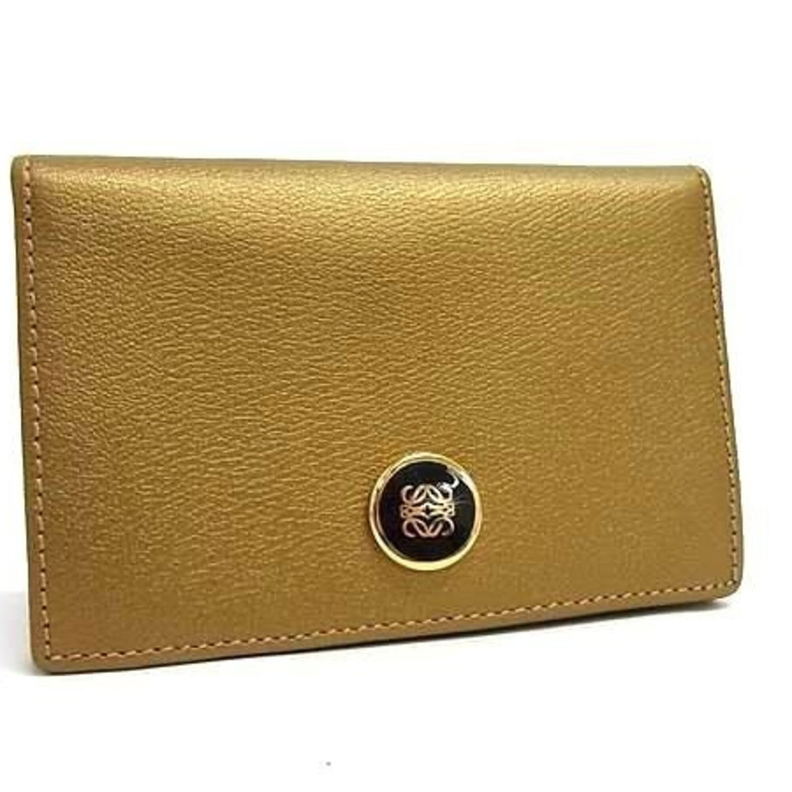 Card Case Leather by Loewe: Card Case Leather by Loewe Loewe's Card Case Leather boasts a sleek, gold-toned design that adds a touch of sophistication to any wallet or card holder. Made from high-quality leather, this compact ca