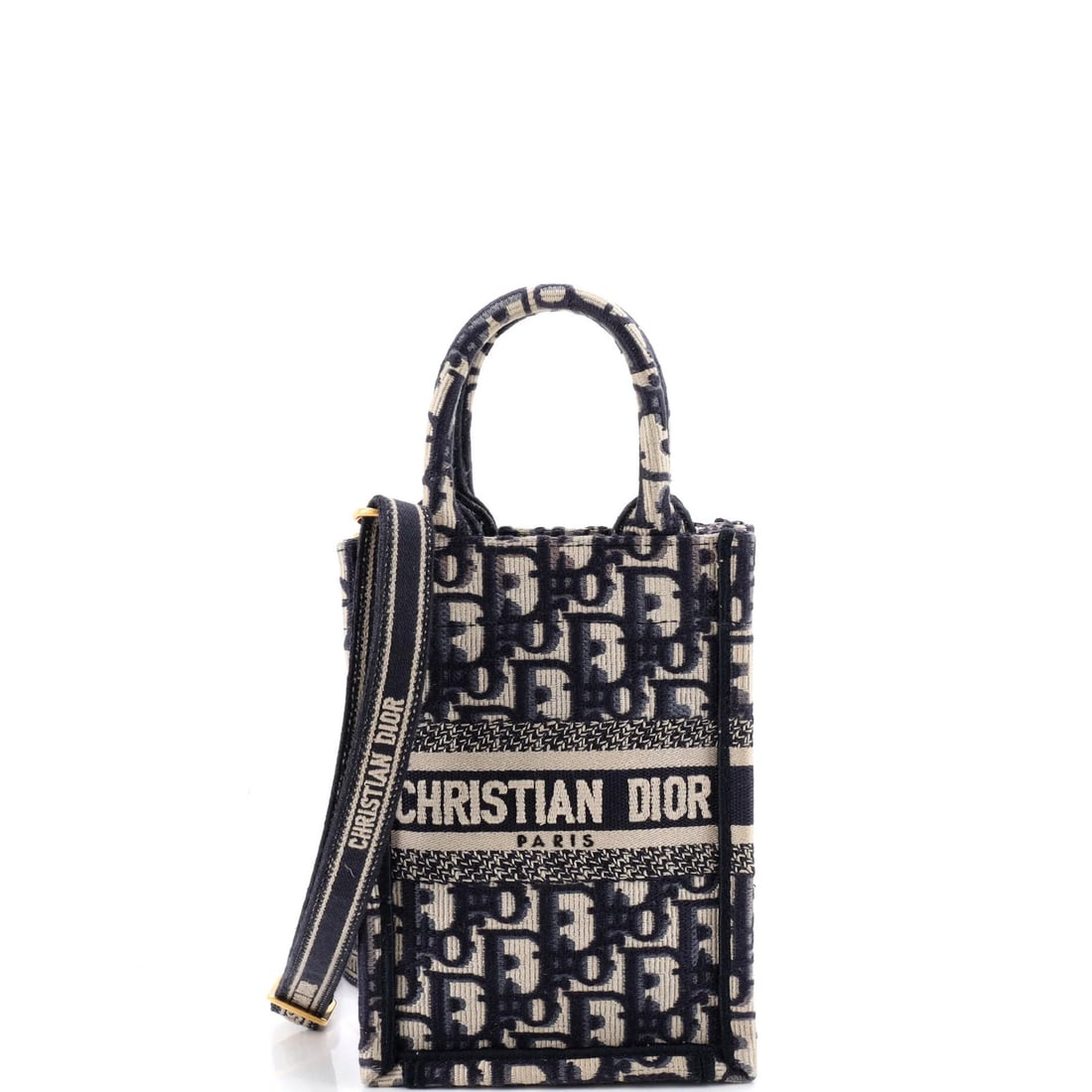 Christian Dior Oblique Mini Canvas Book Tote Phone Bag: Christian Dior Oblique Mini Canvas Book Tote Phone Bag Blue canvas mini cross body bag with gold hardware, featuring a book tote phone bag design. The bag measures 7" tall, 5" wide, and 2" deep, with