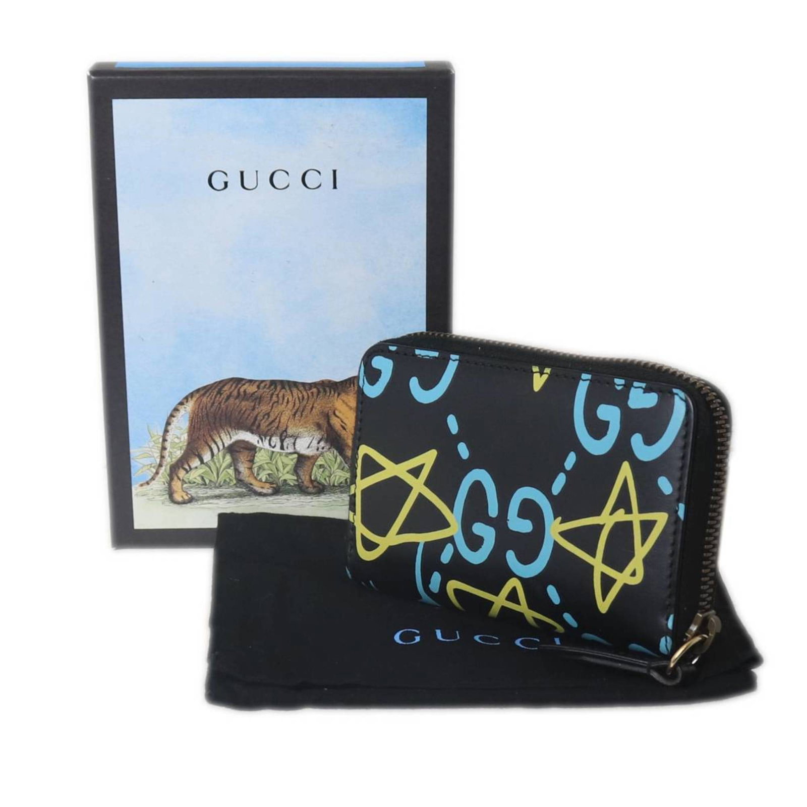 Gucci Coin Purse/ Coin Case: Gucci Coin Purse/ Coin Case This Gucci Coin Purse/ Coin Case is a vibrant multi-color design, showcasing the iconic brand's signature style. Measuring 8cm x 12cm x 2cm, it features a sturdy zipper