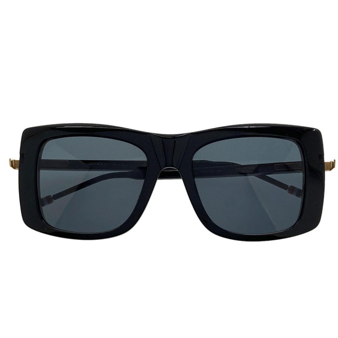 Simple Design Sunglasses Plastic Thom: Simple Design Sunglasses Plastic Thom Simple Design Sunglasses with Black Plastic Frame. Made from high-quality plastic, these sunglasses feature a classic black design that's perfect for everyday wea
