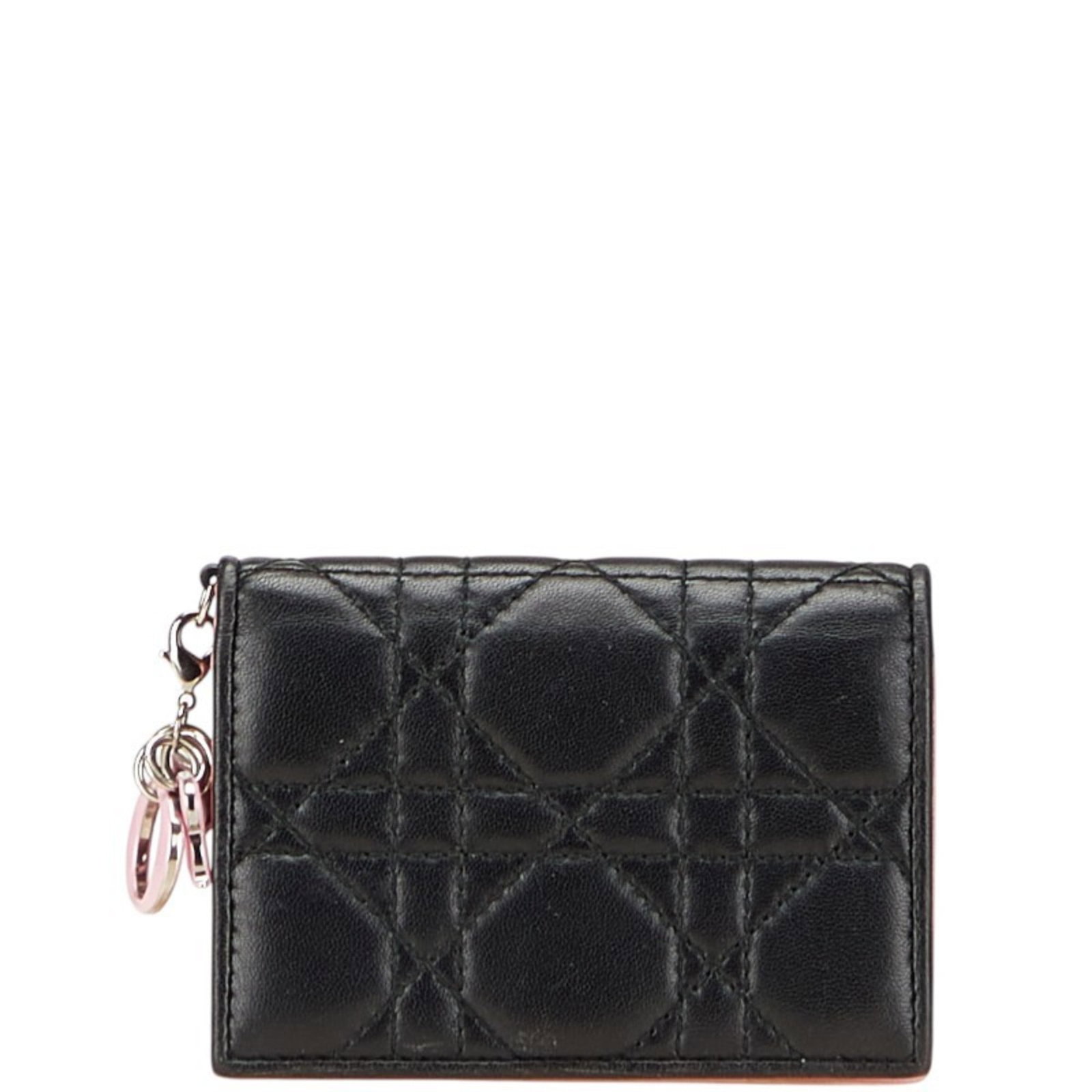 Card Case Leather By Dior: Card Case Leather By Dior Card case by Dior in black leather, measuring 7.5cm x 10.5cm x 1.5cm, featuring a sleek and sophisticated design. The pink variant is also available, offering a pop of color