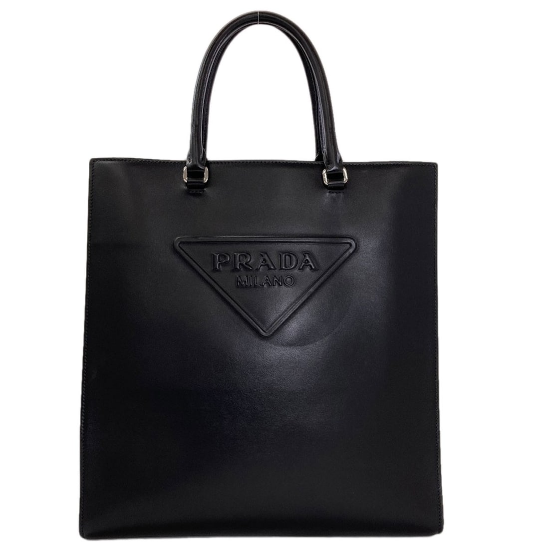 Calf Handbag Prada Logo: Calf Handbag Prada Logo Calf leather handbag with a classic Prada logo, crafted in black. This timeless design showcases the iconic brand's signature style, with a sleek and sophisticated exterior.