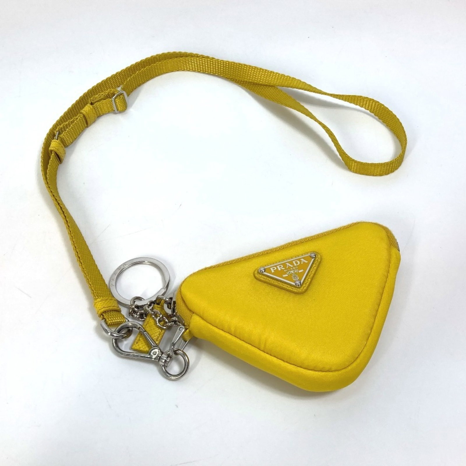 Nylon Prada Pouch: Nylon Prada Pouch Yellow Nylon Prada Pouch with Box. This nylon pouch features a bright yellow color and measures 7.5cm x 10.5cm. Comes with a box. Item Specifics: Brand: Prada Type: Pouch Material: N