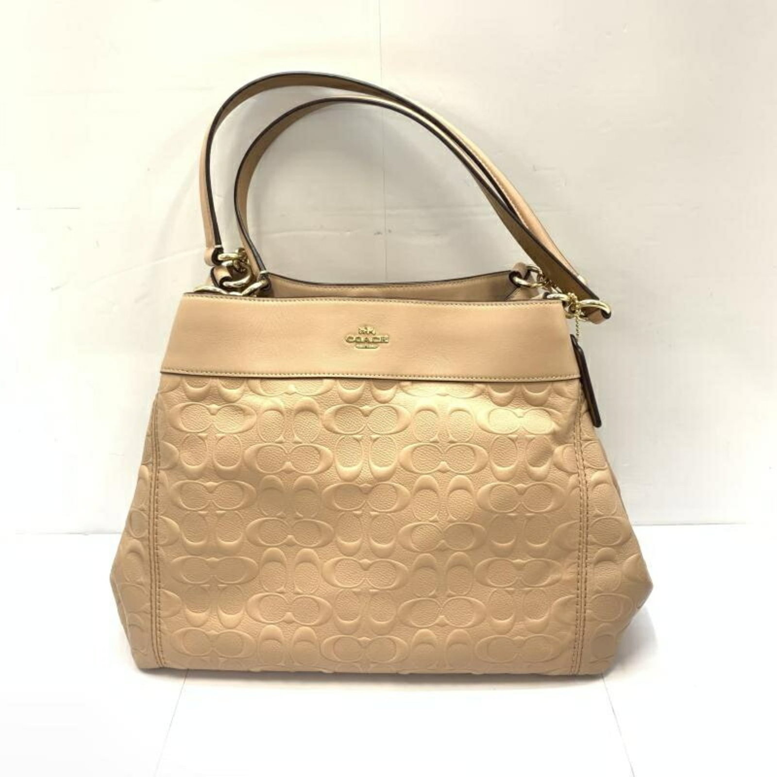 Signature Line Coach Tote Bag: Signature Line Coach Tote Bag Signature Line Coach Tote Bag - A stylish and spacious tote bag with clean lines and a classic design, measuring 27cm x 35cm x 9cm. Made from high-quality materials,