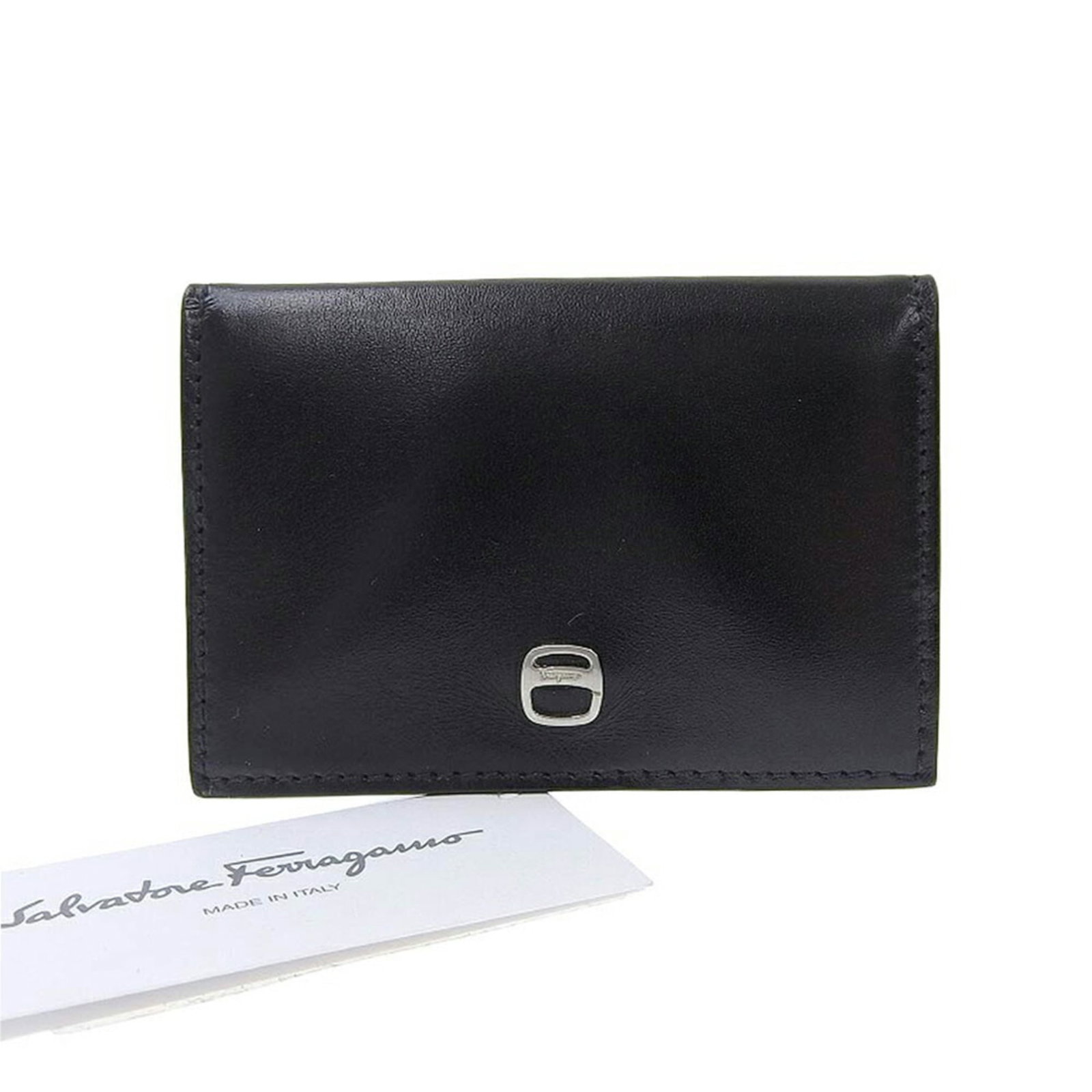 Salvatore Ferragamo Coin Purse/ Coin Case Leather: Salvatore Ferragamo Coin Purse/ Coin Case Leather The Salvatore Ferragamo Coin Purse/ Coin Case Leather is a sleek, black leather accessory with a compact size of 6.5cm x 9.5cm x 1.2cm. Made from