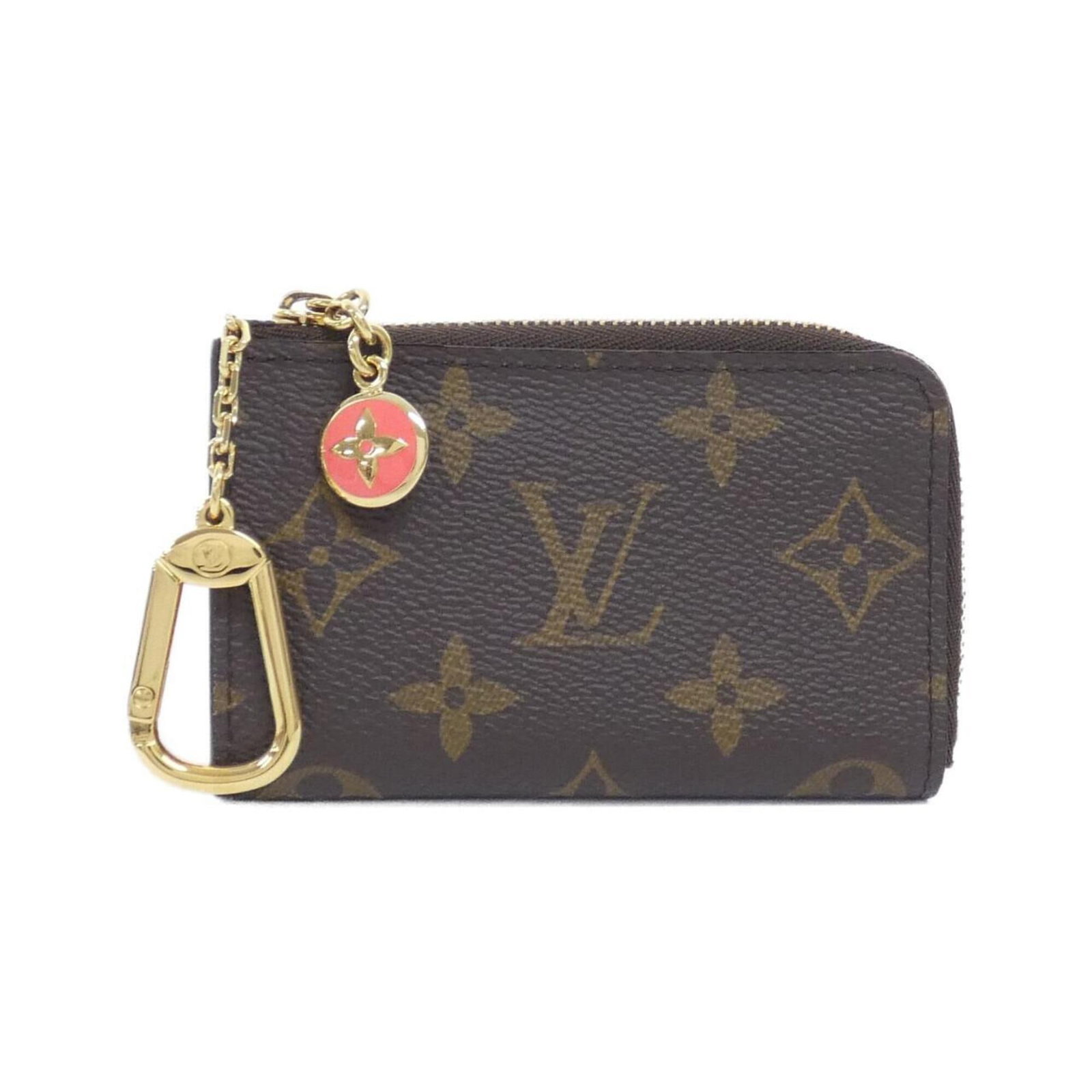 Louis Vuitton Coin Purse/ Coin Case Coated Canvas: Louis Vuitton Coin Purse/ Coin Case Coated Canvas Coated canvas construction provides a durable and stylish finish for this Louis Vuitton coin purse. The marron color and classic design make it a time