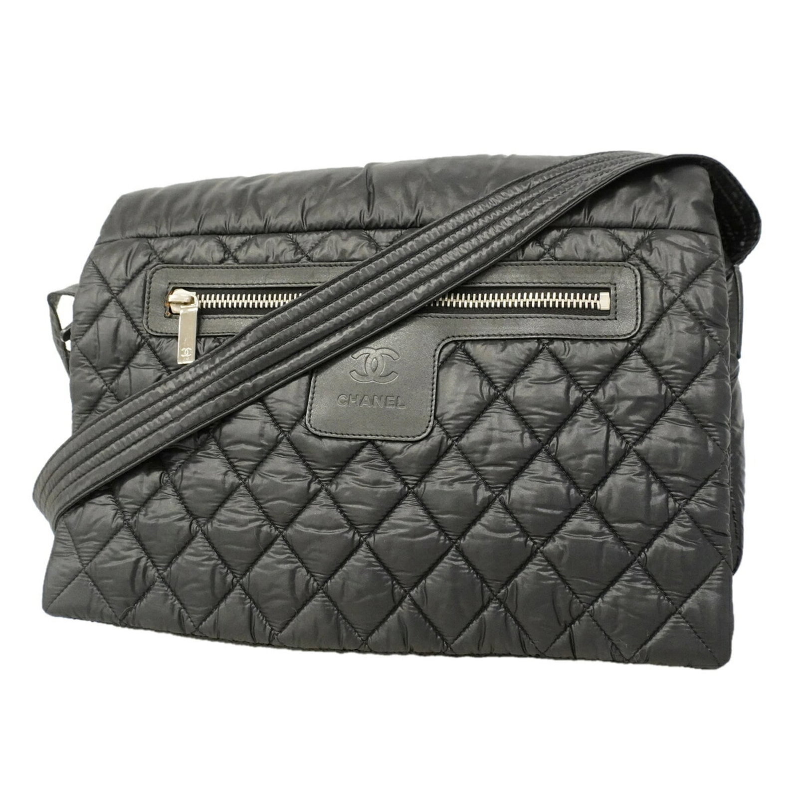Nylon Chanel Bag Shoulder: Nylon Chanel Bag Shoulder Black Nylon Chanel Shoulder Bag with Silver Hardware. This sleek shoulder bag features a durable nylon material and silver hardware, measuring 26cm x 34.5cm x 9.5cm. Its