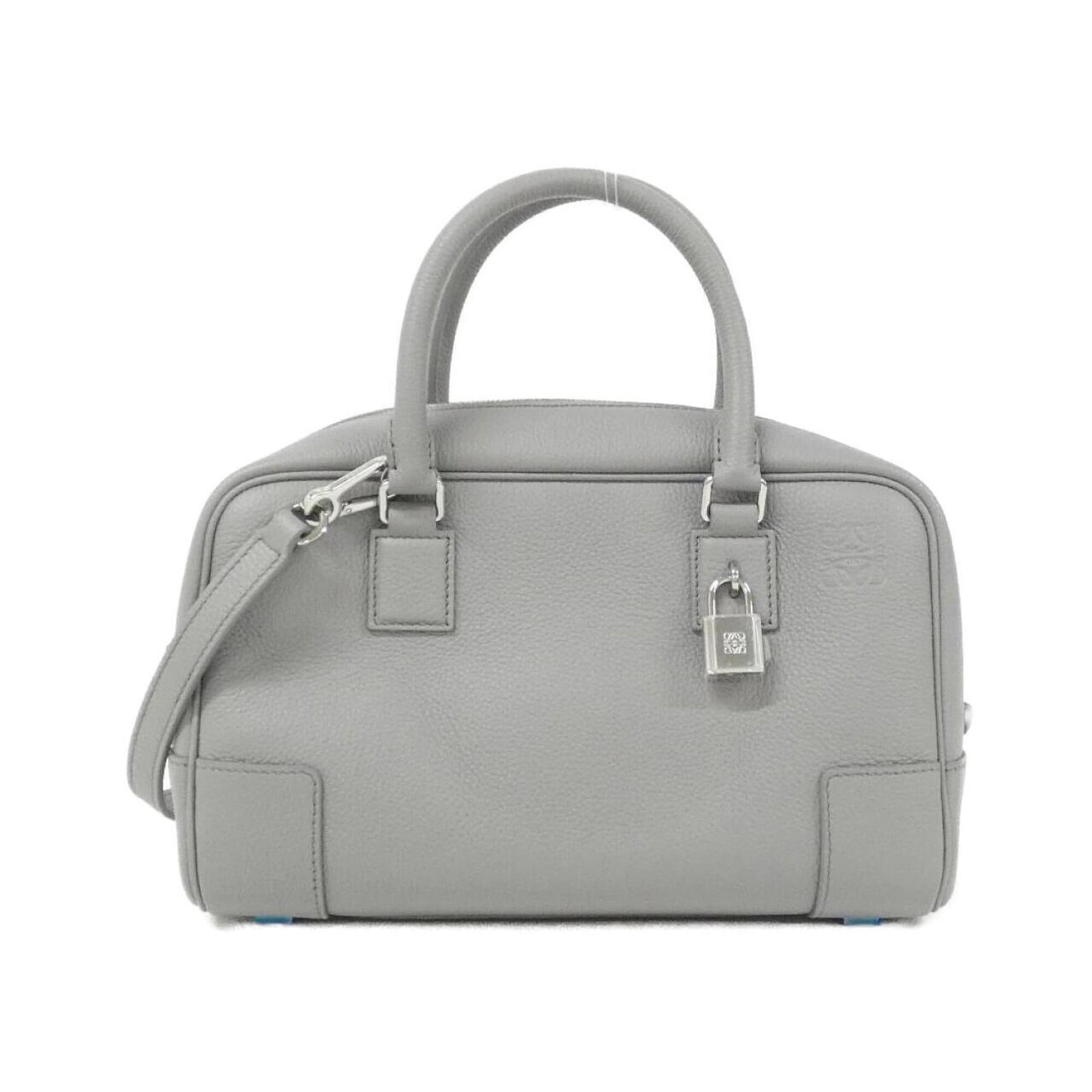 Handbag Leather Handbag: Handbag Leather Handbag The Loewe MPN A039N07X02 Handbag is a stylish and sophisticated leather handbag crafted from high-quality calfskin. Its sleek gray color and compact size make it a versatile