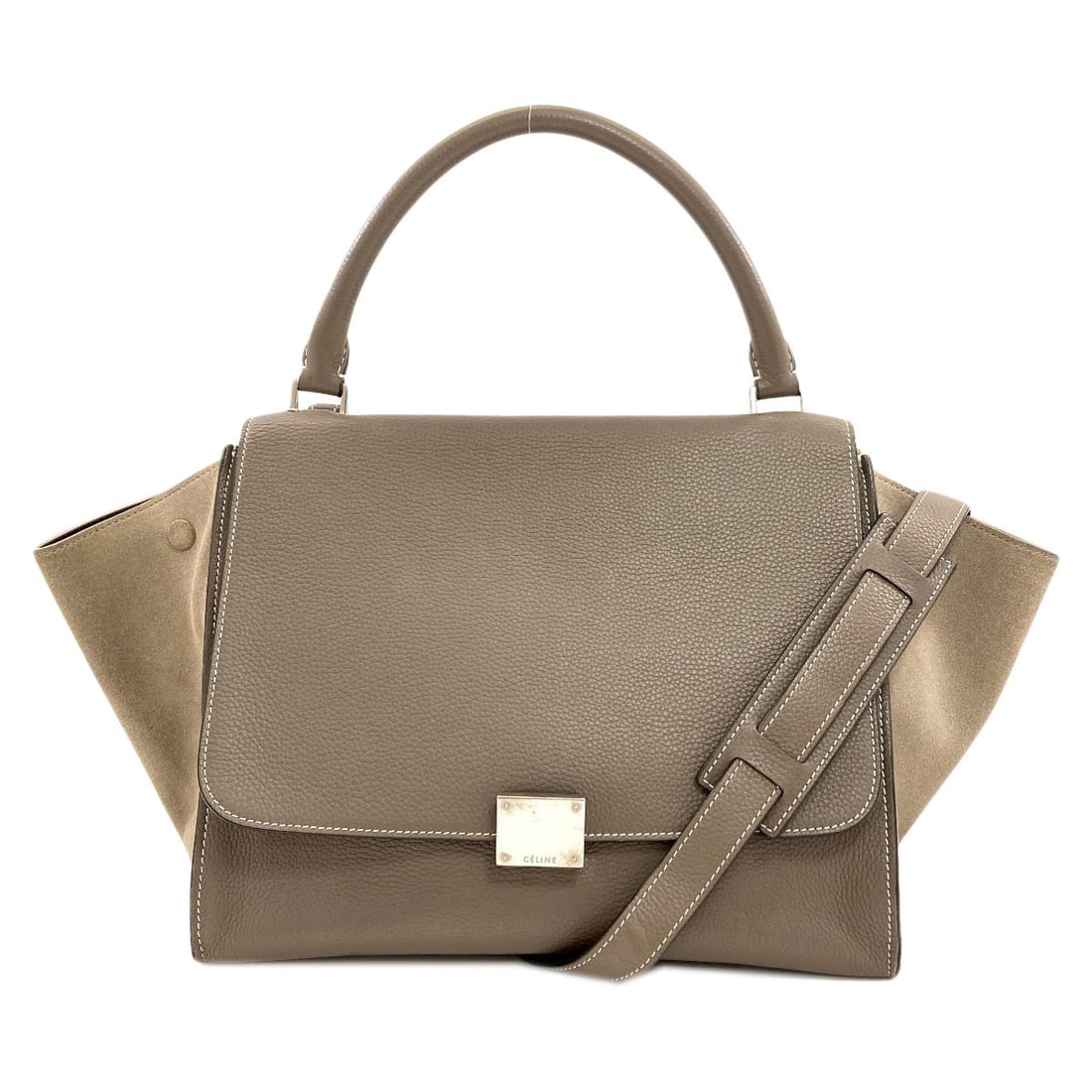 Calf Suede Trapeze 2Way Handbag: Calf Suede Trapeze 2Way Handbag Calf suede trapeze 2-way handbag in brown, featuring a classic design with a signature. The exterior is made of high-quality calf suede, providing a soft and luxurious 