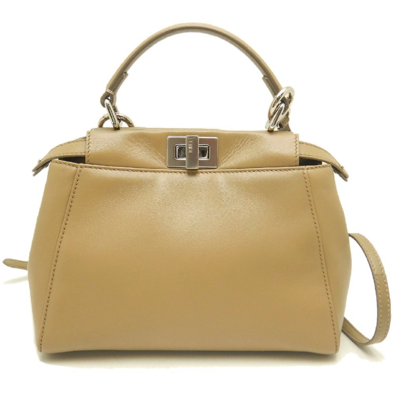 Handbag Leather Fendi: Handbag Leather Fendi Beige leather Fendi handbag with silver hardware, featuring a turn lock closure. The bag measures 17.5cm x 23cm x 11.5cm and has adjustable strap lengths of 101cm to 135cm. This