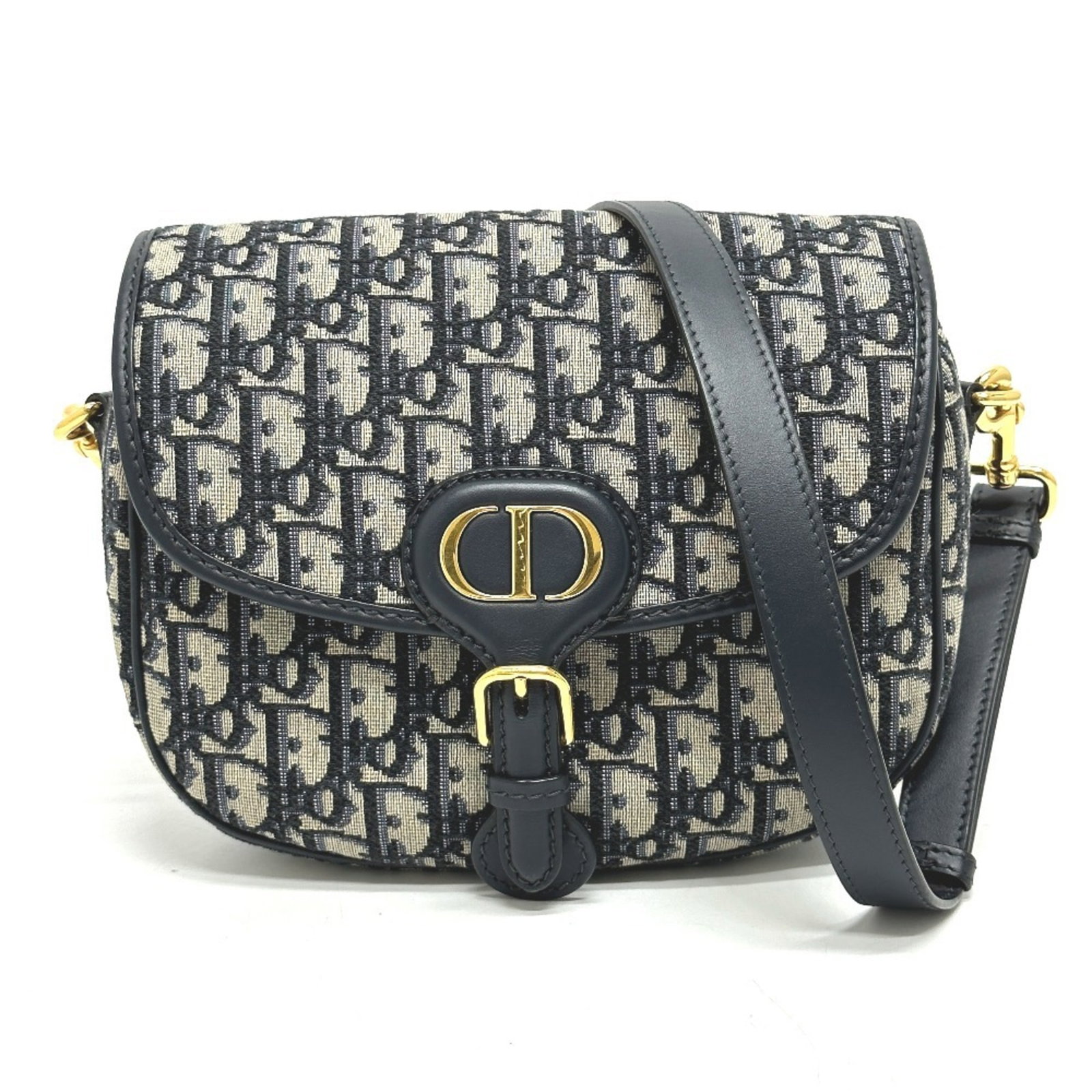 Shoulder Bag Leather Christian Dior: Shoulder Bag Leather Christian Dior The Christian Dior shoulder bag is a stylish and sleek option, crafted from high-quality leather in a versatile gray color. Measuring 19cm x 23cm x 7cm, it