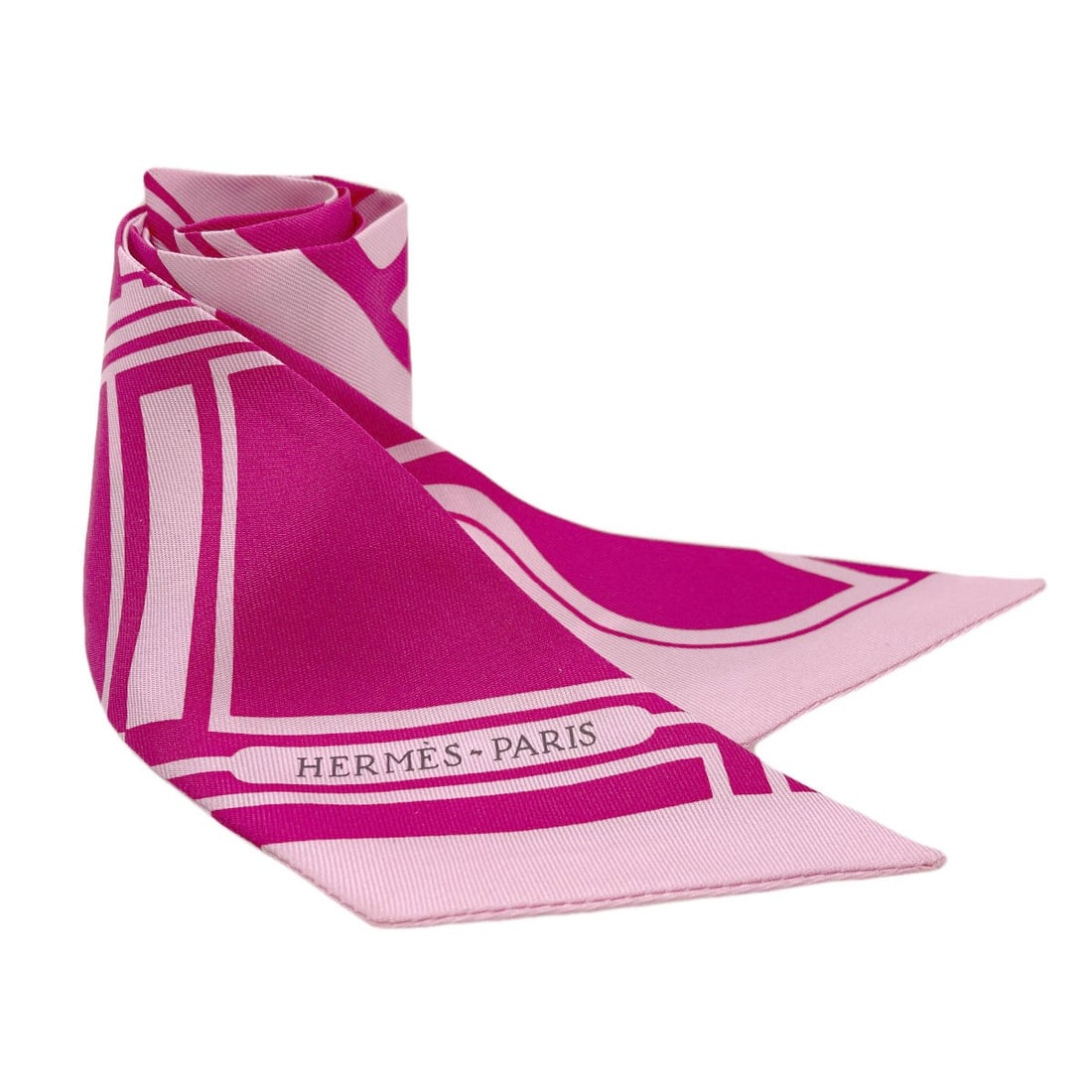 Hermes Silk Twilly Scarf: Hermes Silk Twilly Scarf Pink silk twilly scarf from HERMES, featuring a vibrant exterior color. Made from high-quality silk, this scarf is a stylish accessory. The signature is present. Item Specific