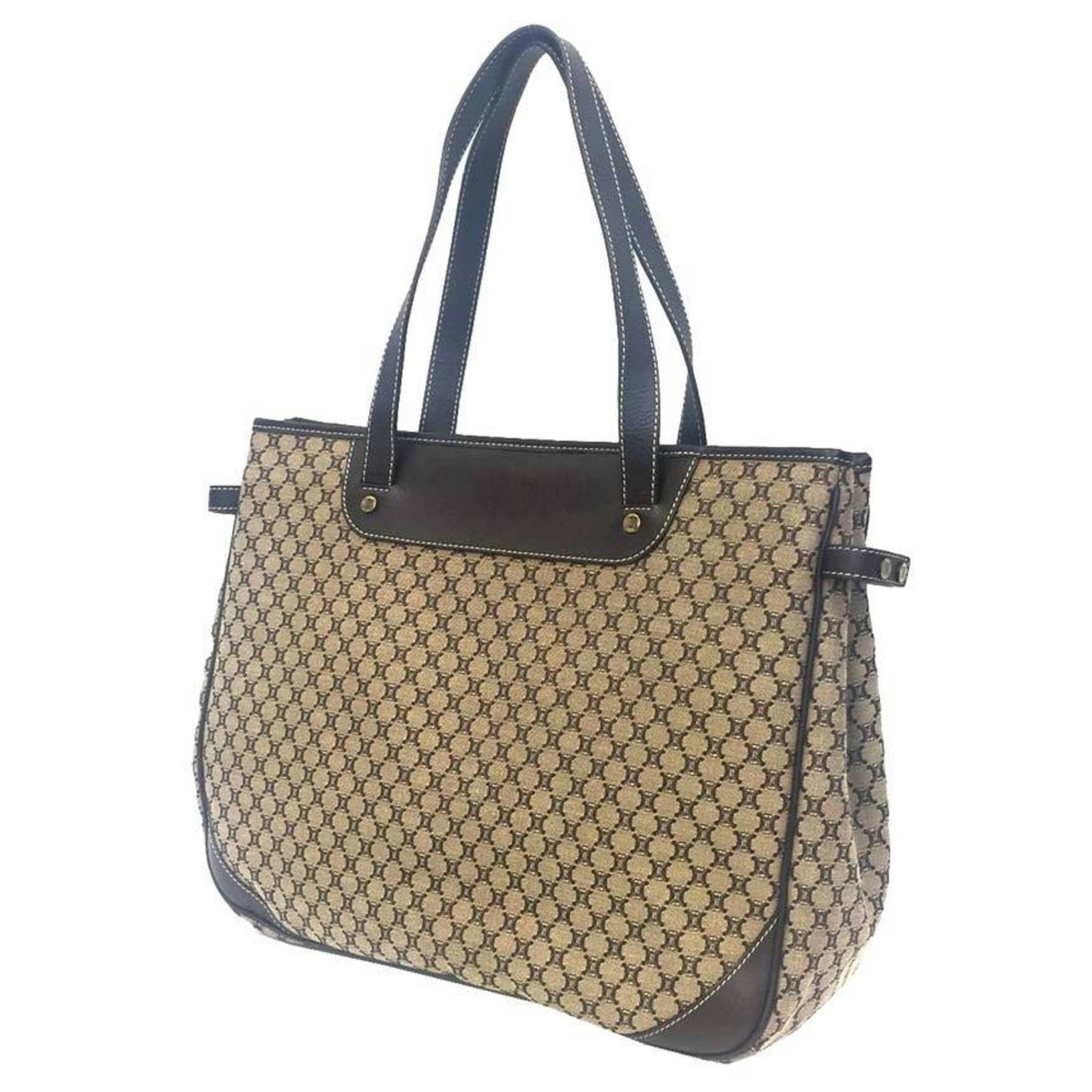 Canvas leather tote bag: Canvas leather tote bag Canvas leather tote bag in beige and brown, measuring 28cm x 34cm x 12cm, comes with a dust bag for protection. The bag's canvas and leather materials provide a sturdy and styl