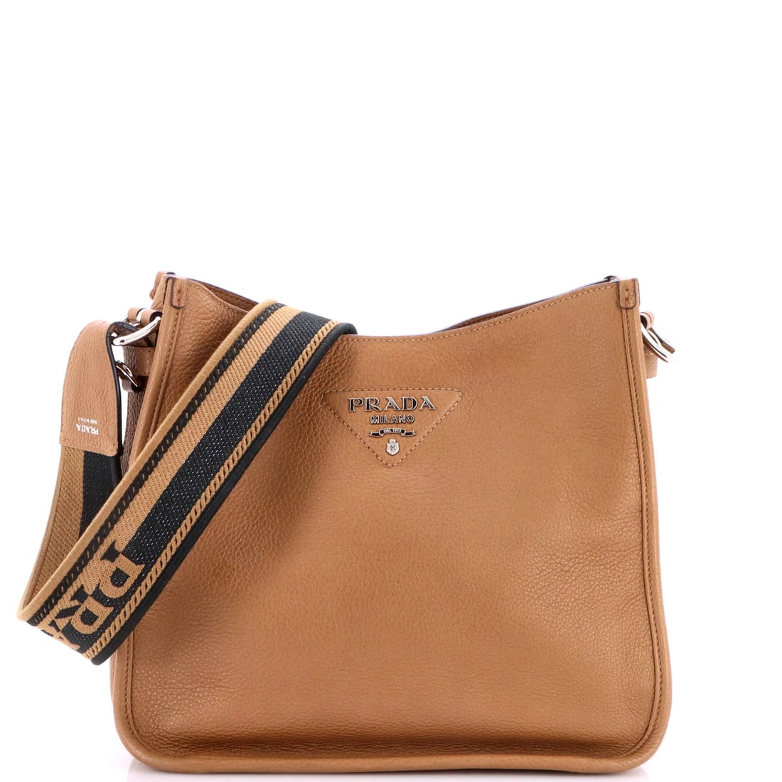 Logo Strap Hobo Medium Leather: Logo Strap Hobo Medium Leather Brown leather medium logo strap hobo with a classic design, featuring a signature on the exterior. This medium-sized hobo has a brown exterior with a black interior,