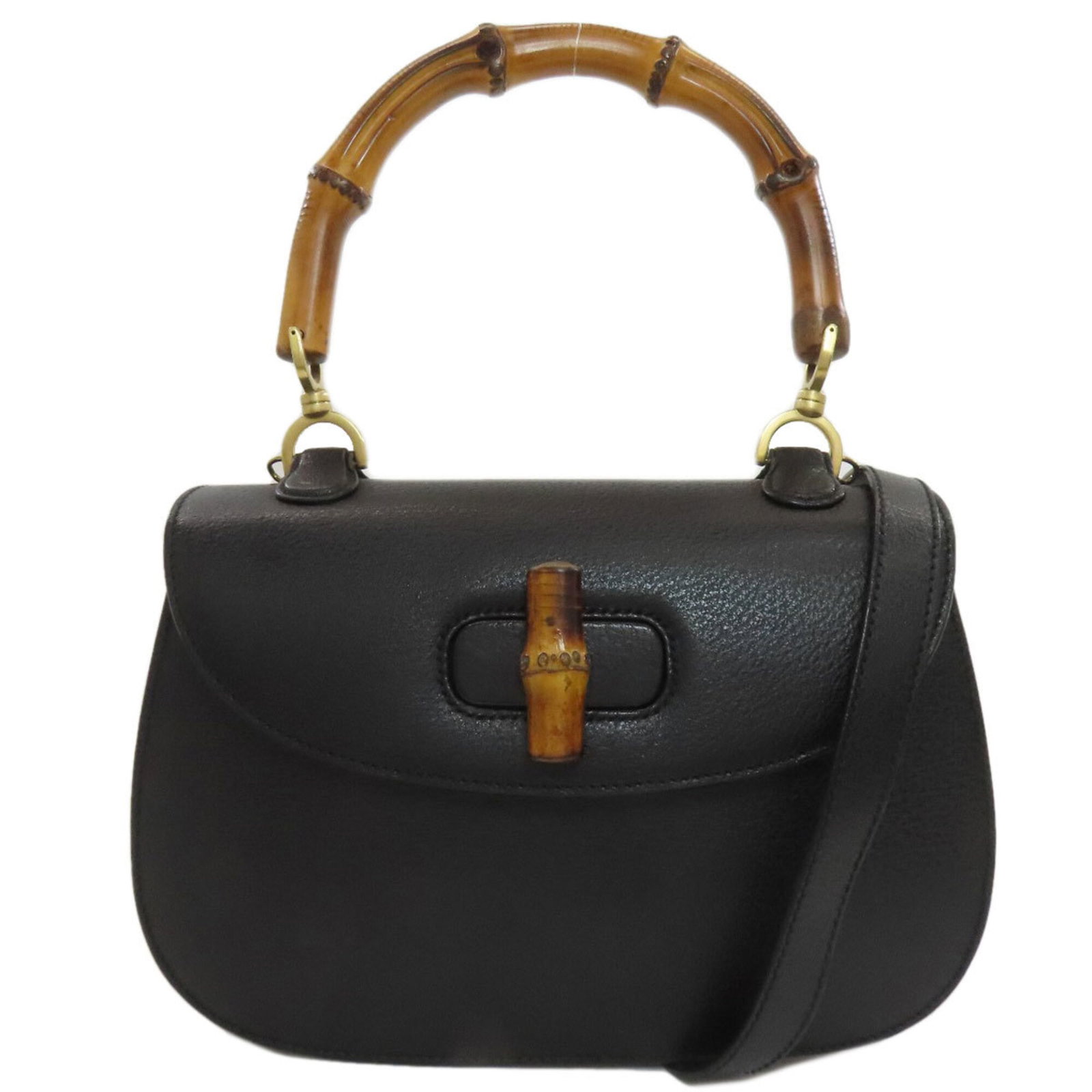 Handbag Leather Gucci: Handbag Leather Gucci Black Calfskin Leather Gucci Handbag with Classic Design. Made from high-quality leather, this iconic handbag features a timeless design that exudes luxury and sophistication. It