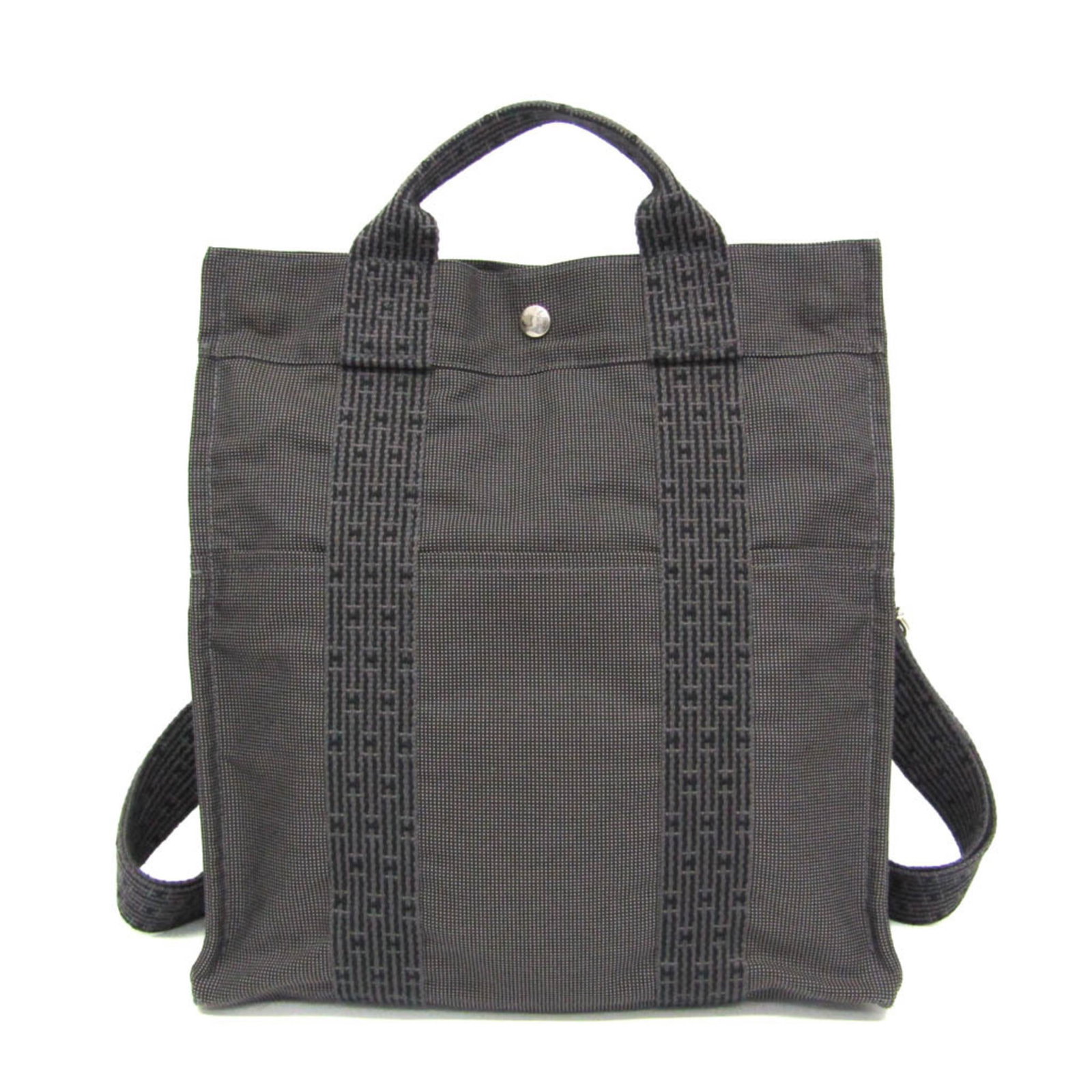 Polyamide Polyester Backpack: Polyamide Polyester Backpack The Hermes Line Polyamide Polyester Backpack features a sleek black and gray design with silver hardware, making it a versatile and stylish accessory. With an adjustable