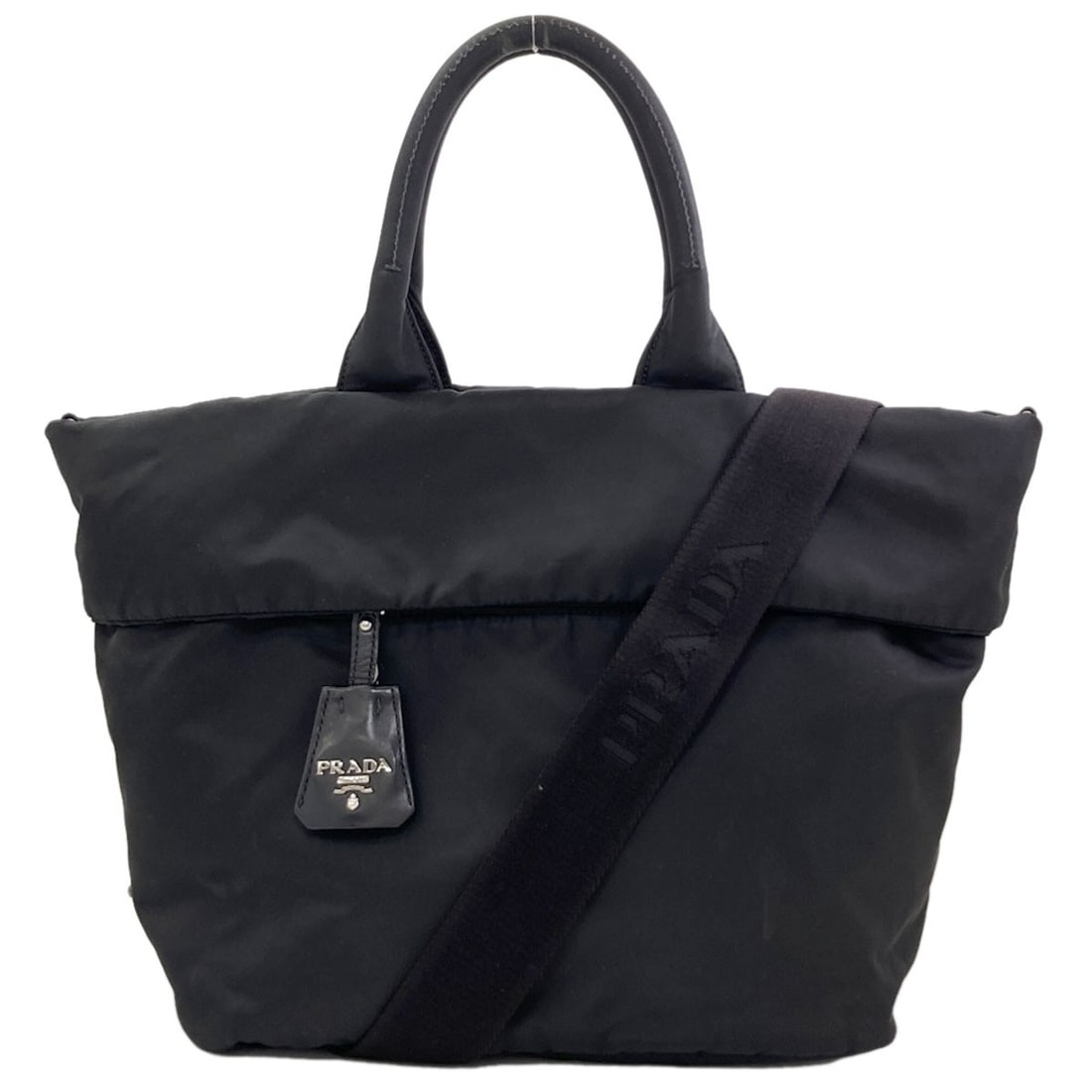 Double Reversible 2-Way Handbag Nylon Prada Tessuto Bn1959: Double Reversible 2-Way Handbag Nylon Prada Tessuto Bn1959 Double Reversible 2-Way Handbag in Black Nylon with Detachable Strap. This Prada handbag features a sleek black exterior with a reversible