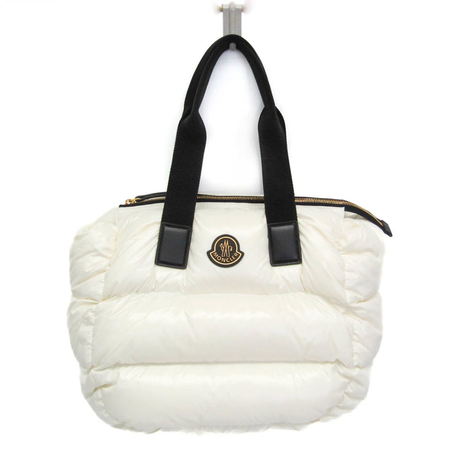 Nylon Moncler Tote Handbag: Nylon Moncler Tote Handbag Nylon Moncler Tote Handbag features a sleek black and white design with a 35cm zipper closure, open pocket, and 53cm handle length. Made from durable nylon material, this