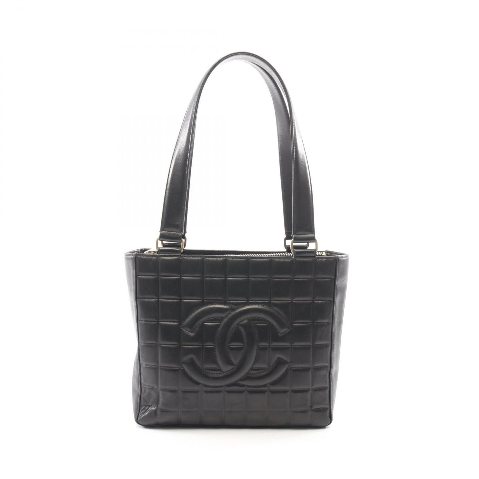 Chanel Handbag Leather Tote: Chanel Handbag Leather Tote Black lambskin leather Chanel handbag tote with classic design and timeless elegance. This luxurious tote measures 21cm x 24cm x 8cm and features high-quality leather