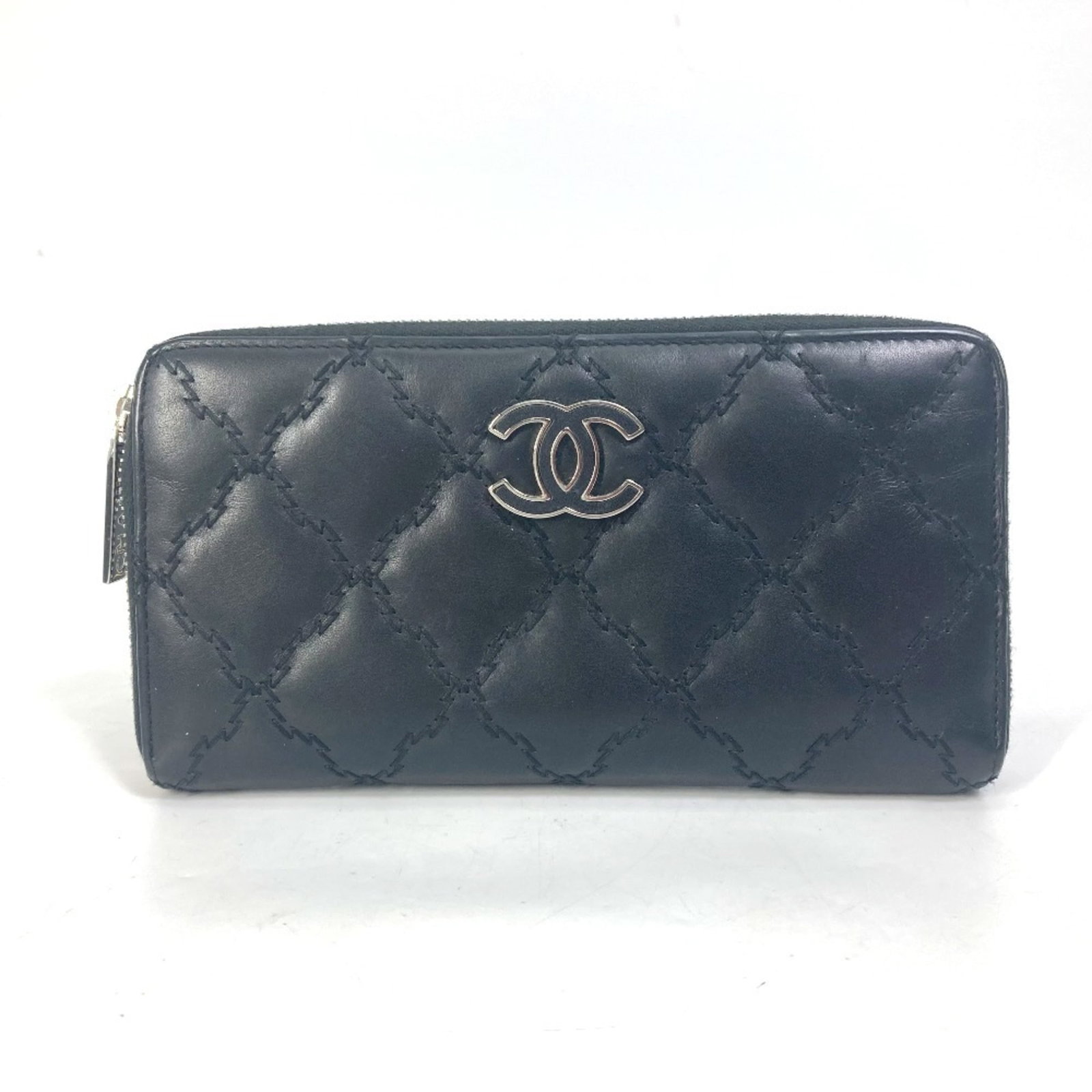 Chanel Long Wallet (Bi-Fold) Leather: Chanel Long Wallet (Bi-Fold) Leather This sleek black bi-fold wallet from Chanel features high-quality lambskin leather, perfect for everyday use. The compact design and classic style make it a