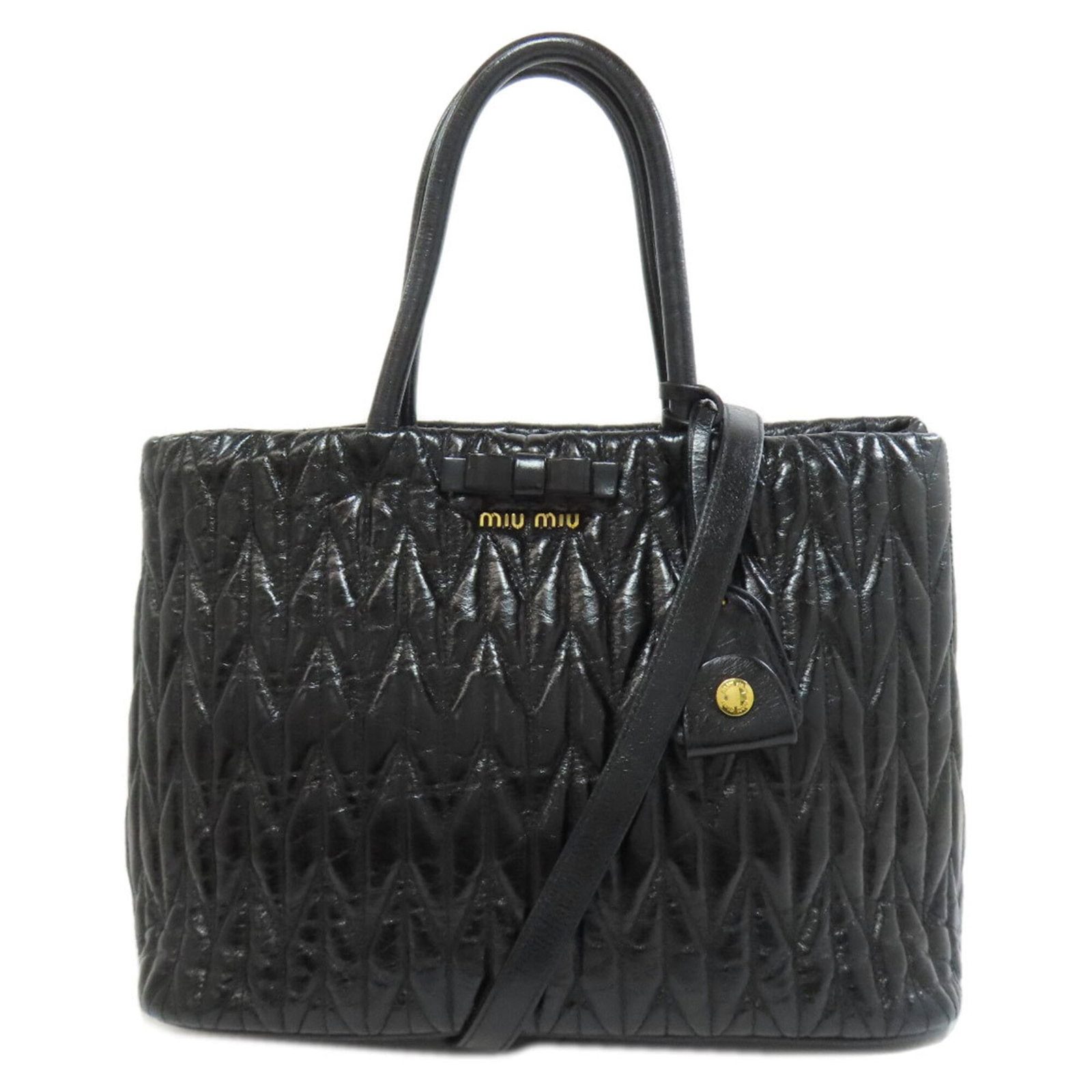 Handbag Miu Leather: Handbag Miu Leather The Miu Miu Handbag is crafted from high-quality calfskin leather, offering a sleek and sophisticated design. Measuring 21cm x 30cm x 18cm, this stylish bag features a classic