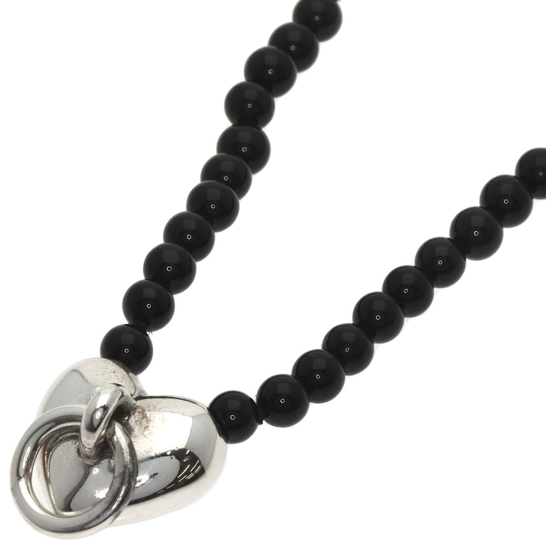 Tiffany Co Heart Knock Silver Onyx Necklace: Tiffany Co Heart Knock Silver Onyx Necklace Silver onyx necklace with a Tiffany Co. heart knock design, showcasing a striking combination of modern style and elegant sophistication. The necklace