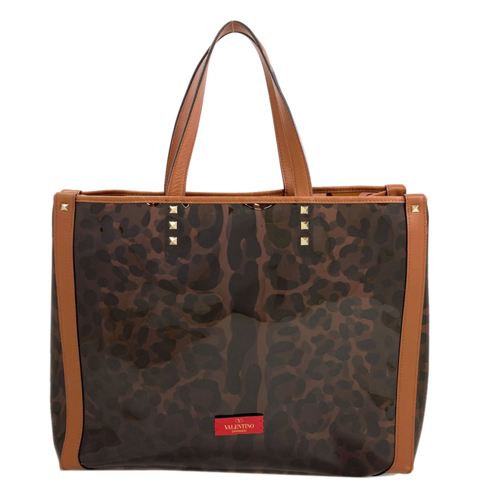 Tote Bag Vinyl Valentino: Tote Bag Vinyl Valentino Valentino's iconic Tote Bag Vinyl is a statement piece, boasting a striking brown color and sleek design. Made from durable vinyl, this tote bag measures 29cm x 37cm x 14cm,