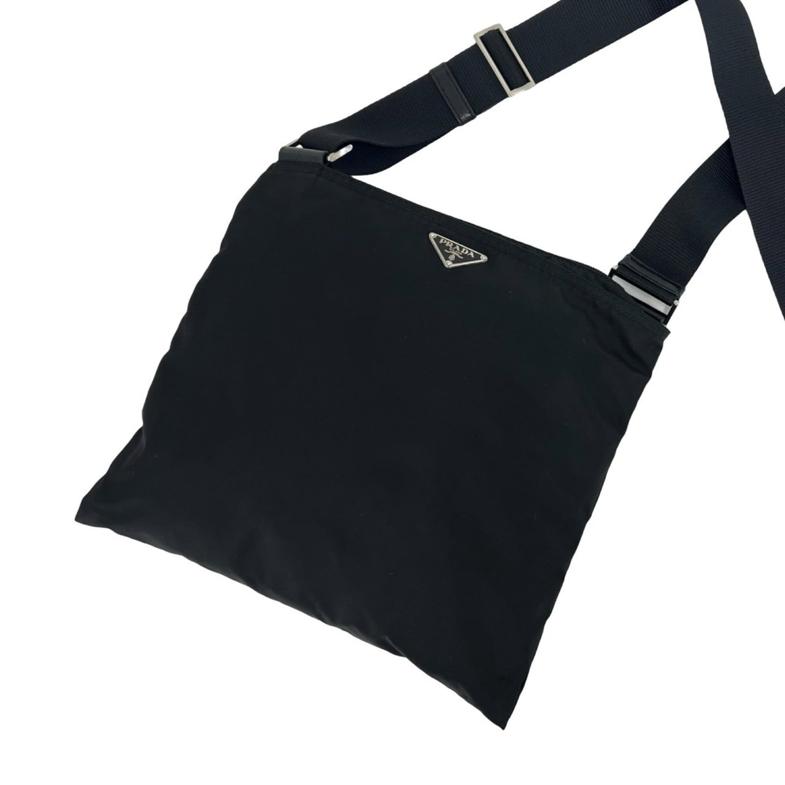 Pochette Nylon Shoulder Bag Prada: Pochette Nylon Shoulder Bag Prada Black Prada Pochette Nylon Shoulder Bag with clean lines and a compact 26cm x 28.5cm size, perfect for carrying essentials. Made from durable nylon, this stylish