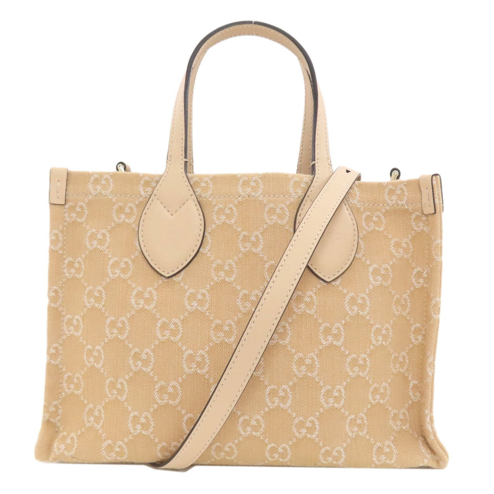 Handbag Canvas Gucci: Handbag Canvas Gucci Canvas Gucci handbag in beige, featuring a signature and a sturdy canvas material. Measuring 19cm x 27cm x 11.5cm, this 30cm long handle bag has adjustable strap lengths of 106cm 