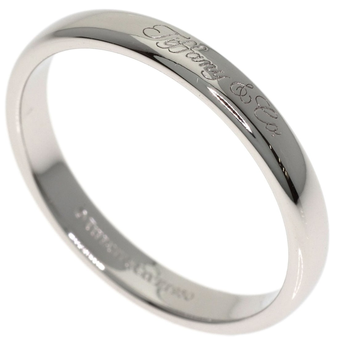 Tiffany Co Platinum Wedding Ring: Tiffany Co Platinum Wedding Ring Platinum Wedding Ring from Tiffany & Co. in a sleek silver finish, crafted from 950 platinum. This stylish ring features a classic design with no main stone, making it