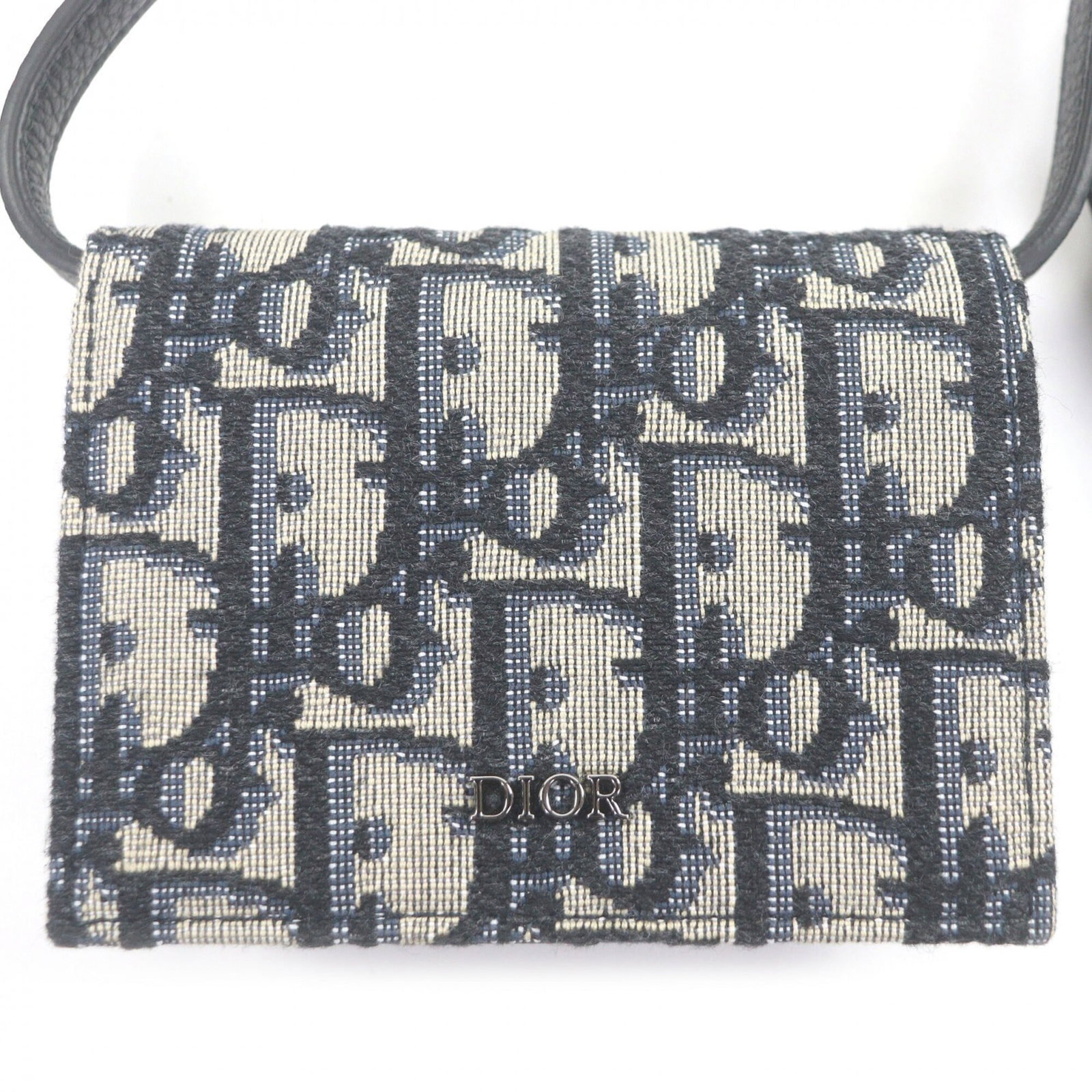 Canvas leather pouch from Dior Homme: Canvas leather pouch from Dior Homme Canvas leather pouch from Dior Homme, made from canvas and leather, features a beige and navy color combination. The pouch measures 8cm x 10cm x 2.5cm and has a sl