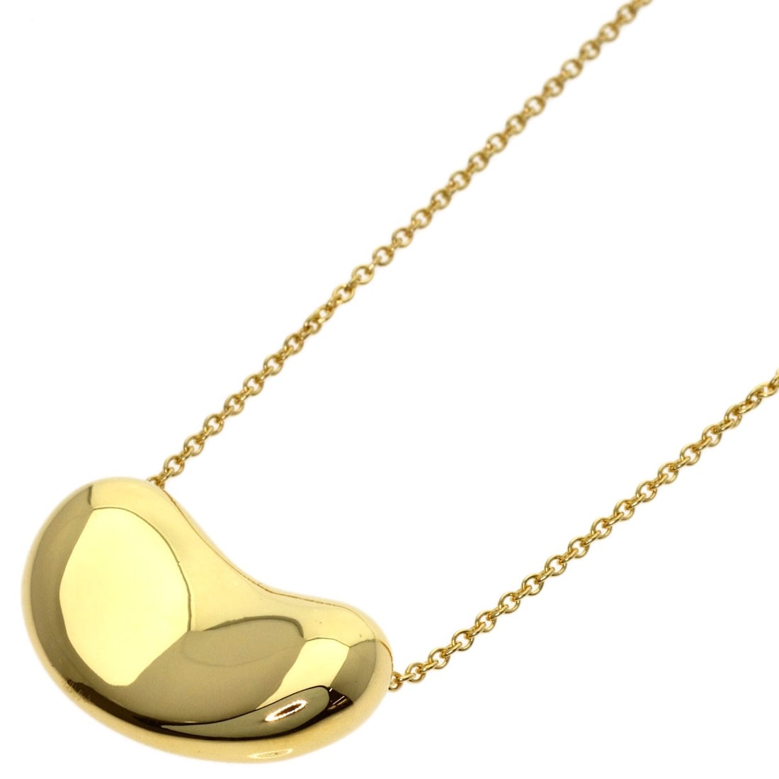 Yellow Gold Tiffany&Co K18 Bean Necklace: Yellow Gold Tiffany&Co K18 Bean Necklace K18 Yellow Gold Tiffany&Co Bean Necklace features a striking design with no main stone, showcasing the beauty of the gold metal. This 15.7-inch long necklace i