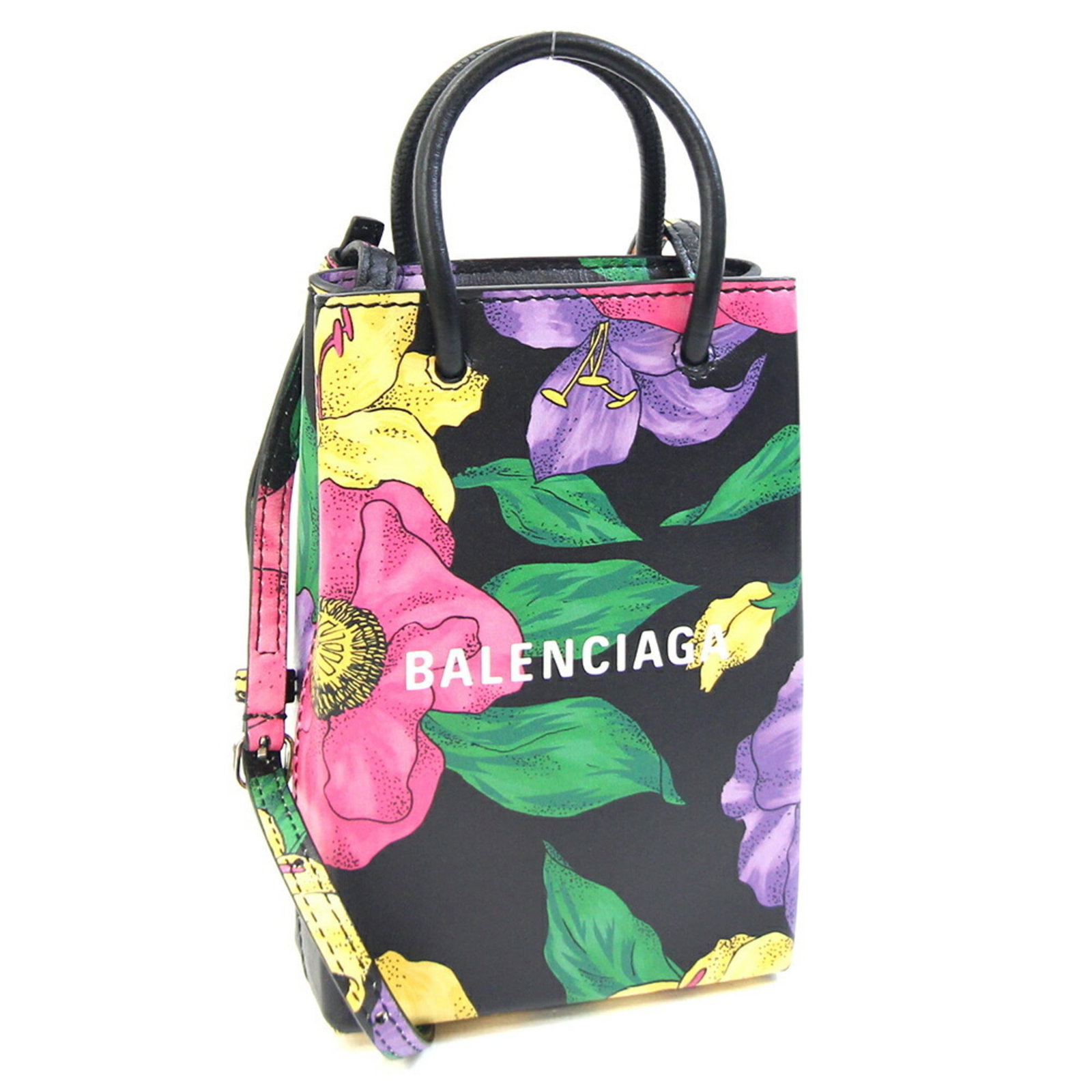 Balenciaga Handbag Pochette Leather: Balenciaga Handbag Pochette Leather Balenciaga's iconic Pochette Leather handbag boasts sleek, modern design with a versatile black leather exterior. This compact, multi-color interior offers ample