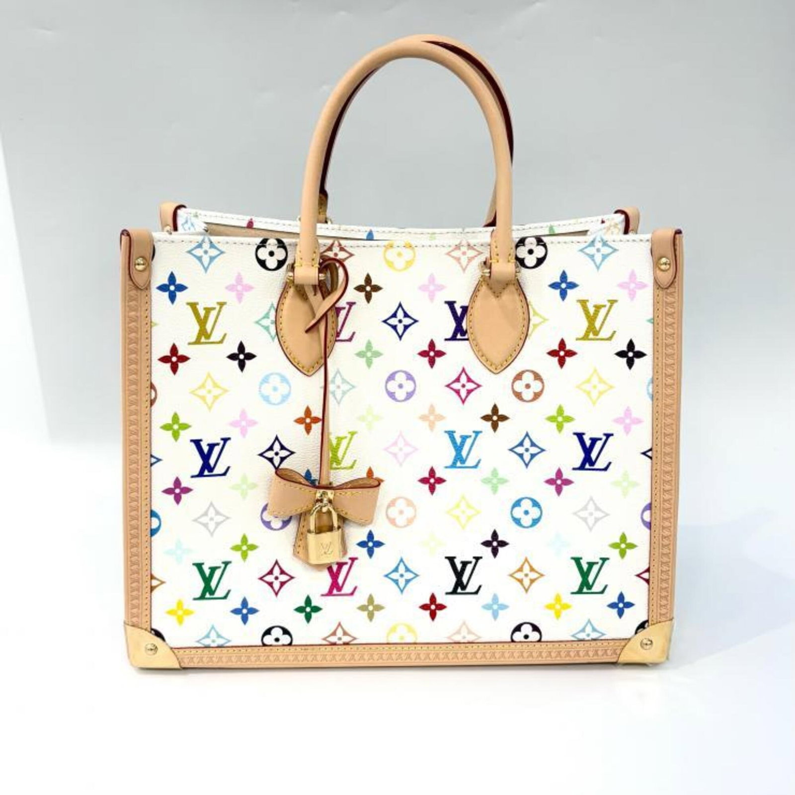 Canvas Leather Louis Vuitton Tote Bag Coated: Canvas Leather Louis Vuitton Tote Bag Coated Coated canvas and leather come together in this Louis Vuitton tote bag, available in a range of colors including beige, blanc, gold, multi-color, and
