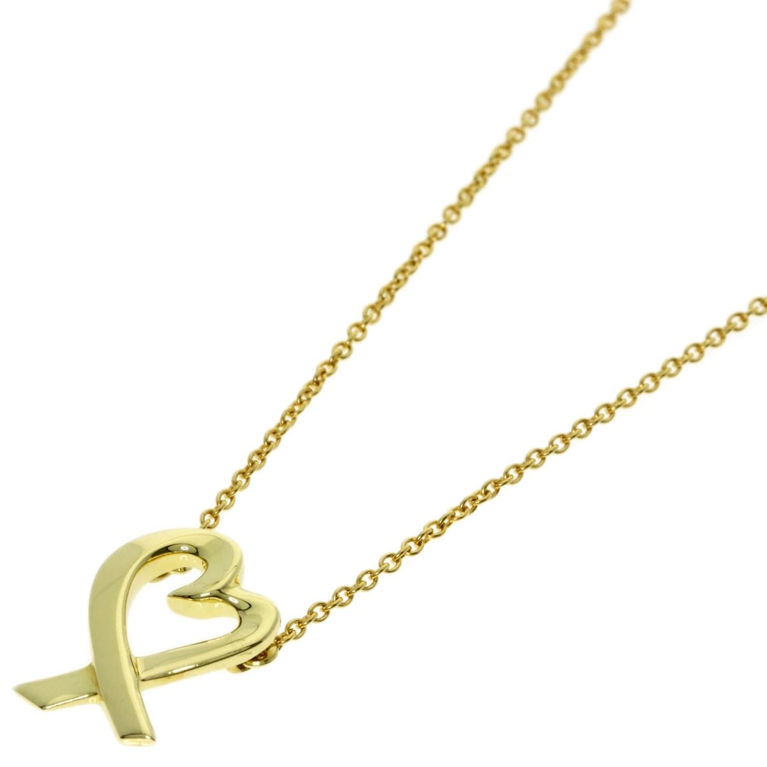 Loving Heart Necklace Tiffany&Co. K18 Yellow Gold: Loving Heart Necklace Tiffany&Co. K18 Yellow Gold K18 Yellow Gold necklace from Tiffany&Co. showcases a sleek, gold design with an open closure. This 16.1-inch long necklace is crafted from