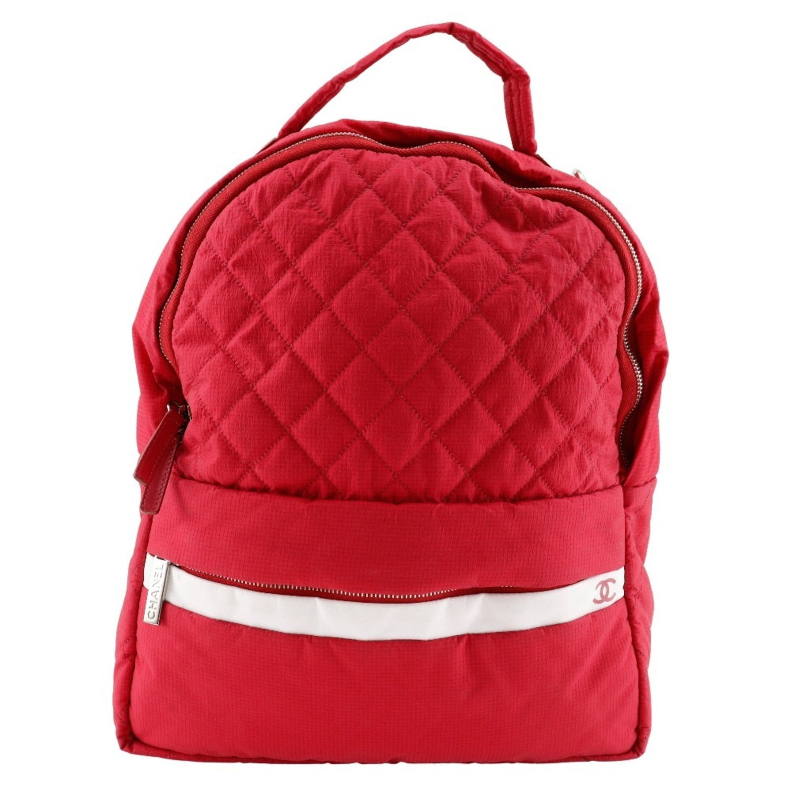Nylon Backpack Chanel: Nylon Backpack Chanel Red Nylon Backpack from Chanel, measuring 34cm x 29cm x 13cm, features a classic design with a bold red color. The backpack comes with a guarantee card, providing added security 
